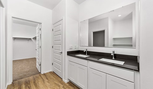 Step into The Dalea at Barnett Village, Marana, Arizona – a perfect blend of comfort, modern living, and energy efficiency. This thoughtfully crafted one-story home spans 2,224 square feet and offers five bedrooms and 3 bathrooms, ideal for families of all sizes.  The open-concept design features a spacious great room that effortlessly connects with the kitchen and dining area, creating an inviting central hub for everyday living and entertaining. The kitchen is equipped with contemporary appliances and a pantry, offering ample storage and convenience for meal preparation.  The primary bedroom, located at the rear of the home, provides a peaceful retreat with a private ensuite bathroom and a generous walk-in closet. The additional four bedrooms are positioned at the front of the house, offering versatility for use as guest rooms, a home office, or children’s bedrooms.  The Dalea floor plan offers the option of a three-car tandem garage, perfect for additional space and larger sized vehicles. Whether it’s morning coffee or evening relaxation, this outdoor space extends your living area into the serene landscape of Barnett Village.  Built with energy efficiency as a priority, the Dalea includes smart home technology, which not only simplifies daily living but also helps reduce utility costs.