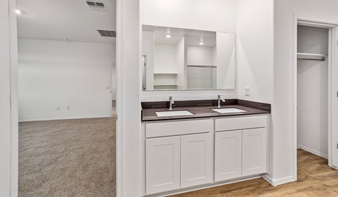 Step into The Dalea at Barnett Village, Marana, Arizona – a perfect blend of comfort, modern living, and energy efficiency. This thoughtfully crafted one-story home spans 2,224 square feet and offers five bedrooms and 3 bathrooms, ideal for families of all sizes.  The open-concept design features a spacious great room that effortlessly connects with the kitchen and dining area, creating an inviting central hub for everyday living and entertaining. The kitchen is equipped with contemporary appliances and a pantry, offering ample storage and convenience for meal preparation.  The primary bedroom, located at the rear of the home, provides a peaceful retreat with a private ensuite bathroom and a generous walk-in closet. The additional four bedrooms are positioned at the front of the house, offering versatility for use as guest rooms, a home office, or children’s bedrooms.  The Dalea floor plan offers the option of a three-car tandem garage, perfect for additional space and larger sized vehicles. Whether it’s morning coffee or evening relaxation, this outdoor space extends your living area into the serene landscape of Barnett Village.  Built with energy efficiency as a priority, the Dalea includes smart home technology, which not only simplifies daily living but also helps reduce utility costs.