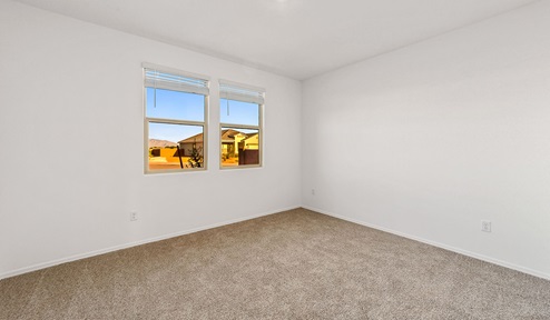 Step into The Dalea at Barnett Village, Marana, Arizona – a perfect blend of comfort, modern living, and energy efficiency. This thoughtfully crafted one-story home spans 2,224 square feet and offers five bedrooms and 3 bathrooms, ideal for families of all sizes.  The open-concept design features a spacious great room that effortlessly connects with the kitchen and dining area, creating an inviting central hub for everyday living and entertaining. The kitchen is equipped with contemporary appliances and a pantry, offering ample storage and convenience for meal preparation.  The primary bedroom, located at the rear of the home, provides a peaceful retreat with a private ensuite bathroom and a generous walk-in closet. The additional four bedrooms are positioned at the front of the house, offering versatility for use as guest rooms, a home office, or children’s bedrooms.  The Dalea floor plan offers the option of a three-car tandem garage, perfect for additional space and larger sized vehicles. Whether it’s morning coffee or evening relaxation, this outdoor space extends your living area into the serene landscape of Barnett Village.  Built with energy efficiency as a priority, the Dalea includes smart home technology, which not only simplifies daily living but also helps reduce utility costs.