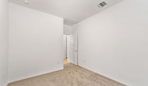 Step into The Dalea at Barnett Village, Marana, Arizona – a perfect blend of comfort, modern living, and energy efficiency. This thoughtfully crafted one-story home spans 2,224 square feet and offers five bedrooms and 3 bathrooms, ideal for families of all sizes.  The open-concept design features a spacious great room that effortlessly connects with the kitchen and dining area, creating an inviting central hub for everyday living and entertaining. The kitchen is equipped with contemporary appliances and a pantry, offering ample storage and convenience for meal preparation.  The primary bedroom, located at the rear of the home, provides a peaceful retreat with a private ensuite bathroom and a generous walk-in closet. The additional four bedrooms are positioned at the front of the house, offering versatility for use as guest rooms, a home office, or children’s bedrooms.  The Dalea floor plan offers the option of a three-car tandem garage, perfect for additional space and larger sized vehicles. Whether it’s morning coffee or evening relaxation, this outdoor space extends your living area into the serene landscape of Barnett Village.  Built with energy efficiency as a priority, the Dalea includes smart home technology, which not only simplifies daily living but also helps reduce utility costs.