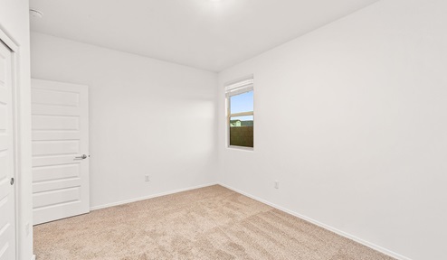 Step into The Dalea at Barnett Village, Marana, Arizona – a perfect blend of comfort, modern living, and energy efficiency. This thoughtfully crafted one-story home spans 2,224 square feet and offers five bedrooms and 3 bathrooms, ideal for families of all sizes.  The open-concept design features a spacious great room that effortlessly connects with the kitchen and dining area, creating an inviting central hub for everyday living and entertaining. The kitchen is equipped with contemporary appliances and a pantry, offering ample storage and convenience for meal preparation.  The primary bedroom, located at the rear of the home, provides a peaceful retreat with a private ensuite bathroom and a generous walk-in closet. The additional four bedrooms are positioned at the front of the house, offering versatility for use as guest rooms, a home office, or children’s bedrooms.  The Dalea floor plan offers the option of a three-car tandem garage, perfect for additional space and larger sized vehicles. Whether it’s morning coffee or evening relaxation, this outdoor space extends your living area into the serene landscape of Barnett Village.  Built with energy efficiency as a priority, the Dalea includes smart home technology, which not only simplifies daily living but also helps reduce utility costs.