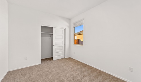 Step into The Dalea at Barnett Village, Marana, Arizona – a perfect blend of comfort, modern living, and energy efficiency. This thoughtfully crafted one-story home spans 2,224 square feet and offers five bedrooms and 3 bathrooms, ideal for families of all sizes.  The open-concept design features a spacious great room that effortlessly connects with the kitchen and dining area, creating an inviting central hub for everyday living and entertaining. The kitchen is equipped with contemporary appliances and a pantry, offering ample storage and convenience for meal preparation.  The primary bedroom, located at the rear of the home, provides a peaceful retreat with a private ensuite bathroom and a generous walk-in closet. The additional four bedrooms are positioned at the front of the house, offering versatility for use as guest rooms, a home office, or children’s bedrooms.  The Dalea floor plan offers the option of a three-car tandem garage, perfect for additional space and larger sized vehicles. Whether it’s morning coffee or evening relaxation, this outdoor space extends your living area into the serene landscape of Barnett Village.  Built with energy efficiency as a priority, the Dalea includes smart home technology, which not only simplifies daily living but also helps reduce utility costs.