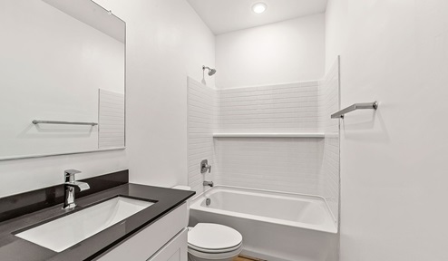 Step into The Dalea at Barnett Village, Marana, Arizona – a perfect blend of comfort, modern living, and energy efficiency. This thoughtfully crafted one-story home spans 2,224 square feet and offers five bedrooms and 3 bathrooms, ideal for families of all sizes.  The open-concept design features a spacious great room that effortlessly connects with the kitchen and dining area, creating an inviting central hub for everyday living and entertaining. The kitchen is equipped with contemporary appliances and a pantry, offering ample storage and convenience for meal preparation.  The primary bedroom, located at the rear of the home, provides a peaceful retreat with a private ensuite bathroom and a generous walk-in closet. The additional four bedrooms are positioned at the front of the house, offering versatility for use as guest rooms, a home office, or children’s bedrooms.  The Dalea floor plan offers the option of a three-car tandem garage, perfect for additional space and larger sized vehicles. Whether it’s morning coffee or evening relaxation, this outdoor space extends your living area into the serene landscape of Barnett Village.  Built with energy efficiency as a priority, the Dalea includes smart home technology, which not only simplifies daily living but also helps reduce utility costs.