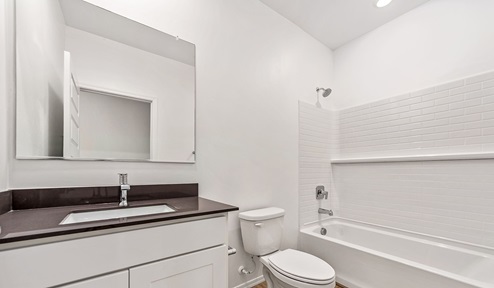 Step into The Dalea at Barnett Village, Marana, Arizona – a perfect blend of comfort, modern living, and energy efficiency. This thoughtfully crafted one-story home spans 2,224 square feet and offers five bedrooms and 3 bathrooms, ideal for families of all sizes.  The open-concept design features a spacious great room that effortlessly connects with the kitchen and dining area, creating an inviting central hub for everyday living and entertaining. The kitchen is equipped with contemporary appliances and a pantry, offering ample storage and convenience for meal preparation.  The primary bedroom, located at the rear of the home, provides a peaceful retreat with a private ensuite bathroom and a generous walk-in closet. The additional four bedrooms are positioned at the front of the house, offering versatility for use as guest rooms, a home office, or children’s bedrooms.  The Dalea floor plan offers the option of a three-car tandem garage, perfect for additional space and larger sized vehicles. Whether it’s morning coffee or evening relaxation, this outdoor space extends your living area into the serene landscape of Barnett Village.  Built with energy efficiency as a priority, the Dalea includes smart home technology, which not only simplifies daily living but also helps reduce utility costs.