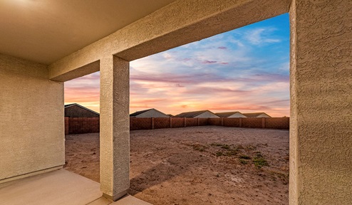 Step into The Dalea at Barnett Village, Marana, Arizona – a perfect blend of comfort, modern living, and energy efficiency. This thoughtfully crafted one-story home spans 2,224 square feet and offers five bedrooms and 3 bathrooms, ideal for families of all sizes.  The open-concept design features a spacious great room that effortlessly connects with the kitchen and dining area, creating an inviting central hub for everyday living and entertaining. The kitchen is equipped with contemporary appliances and a pantry, offering ample storage and convenience for meal preparation.  The primary bedroom, located at the rear of the home, provides a peaceful retreat with a private ensuite bathroom and a generous walk-in closet. The additional four bedrooms are positioned at the front of the house, offering versatility for use as guest rooms, a home office, or children’s bedrooms.  The Dalea floor plan offers the option of a three-car tandem garage, perfect for additional space and larger sized vehicles. Whether it’s morning coffee or evening relaxation, this outdoor space extends your living area into the serene landscape of Barnett Village.  Built with energy efficiency as a priority, the Dalea includes smart home technology, which not only simplifies daily living but also helps reduce utility costs.