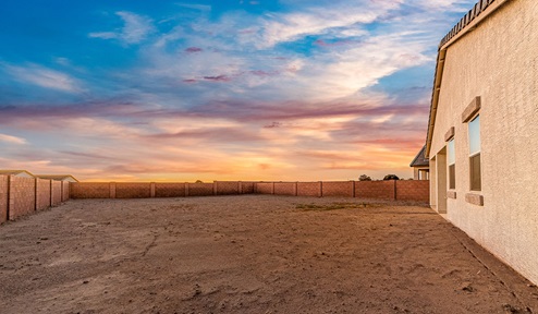 Step into The Dalea at Barnett Village, Marana, Arizona – a perfect blend of comfort, modern living, and energy efficiency. This thoughtfully crafted one-story home spans 2,224 square feet and offers five bedrooms and 3 bathrooms, ideal for families of all sizes.  The open-concept design features a spacious great room that effortlessly connects with the kitchen and dining area, creating an inviting central hub for everyday living and entertaining. The kitchen is equipped with contemporary appliances and a pantry, offering ample storage and convenience for meal preparation.  The primary bedroom, located at the rear of the home, provides a peaceful retreat with a private ensuite bathroom and a generous walk-in closet. The additional four bedrooms are positioned at the front of the house, offering versatility for use as guest rooms, a home office, or children’s bedrooms.  The Dalea floor plan offers the option of a three-car tandem garage, perfect for additional space and larger sized vehicles. Whether it’s morning coffee or evening relaxation, this outdoor space extends your living area into the serene landscape of Barnett Village.  Built with energy efficiency as a priority, the Dalea includes smart home technology, which not only simplifies daily living but also helps reduce utility costs.