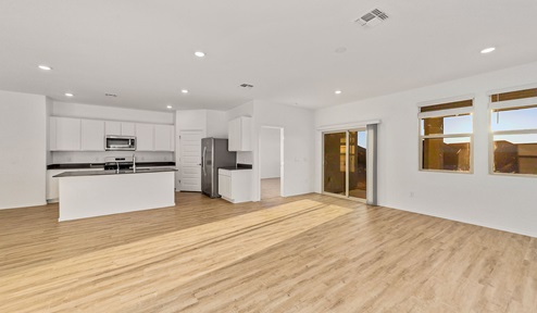 Step into The Dalea at Barnett Village, Marana, Arizona – a perfect blend of comfort, modern living, and energy efficiency. This thoughtfully crafted one-story home spans 2,224 square feet and offers five bedrooms and 3 bathrooms, ideal for families of all sizes.  The open-concept design features a spacious great room that effortlessly connects with the kitchen and dining area, creating an inviting central hub for everyday living and entertaining. The kitchen is equipped with contemporary appliances and a pantry, offering ample storage and convenience for meal preparation.  The primary bedroom, located at the rear of the home, provides a peaceful retreat with a private ensuite bathroom and a generous walk-in closet. The additional four bedrooms are positioned at the front of the house, offering versatility for use as guest rooms, a home office, or children’s bedrooms.  The Dalea floor plan offers the option of a three-car tandem garage, perfect for additional space and larger sized vehicles. Whether it’s morning coffee or evening relaxation, this outdoor space extends your living area into the serene landscape of Barnett Village.  Built with energy efficiency as a priority, the Dalea includes smart home technology, which not only simplifies daily living but also helps reduce utility costs.