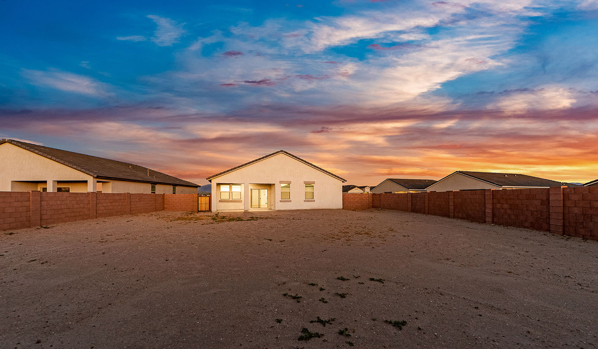 Step into The Dalea at Barnett Village, Marana, Arizona – a perfect blend of comfort, modern living, and energy efficiency. This thoughtfully crafted one-story home spans 2,224 square feet and offers five bedrooms and 3 bathrooms, ideal for families of all sizes.  The open-concept design features a spacious great room that effortlessly connects with the kitchen and dining area, creating an inviting central hub for everyday living and entertaining. The kitchen is equipped with contemporary appliances and a pantry, offering ample storage and convenience for meal preparation.  The primary bedroom, located at the rear of the home, provides a peaceful retreat with a private ensuite bathroom and a generous walk-in closet. The additional four bedrooms are positioned at the front of the house, offering versatility for use as guest rooms, a home office, or children’s bedrooms.  The Dalea floor plan offers the option of a three-car tandem garage, perfect for additional space and larger sized vehicles. Whether it’s morning coffee or evening relaxation, this outdoor space extends your living area into the serene landscape of Barnett Village.  Built with energy efficiency as a priority, the Dalea includes smart home technology, which not only simplifies daily living but also helps reduce utility costs.