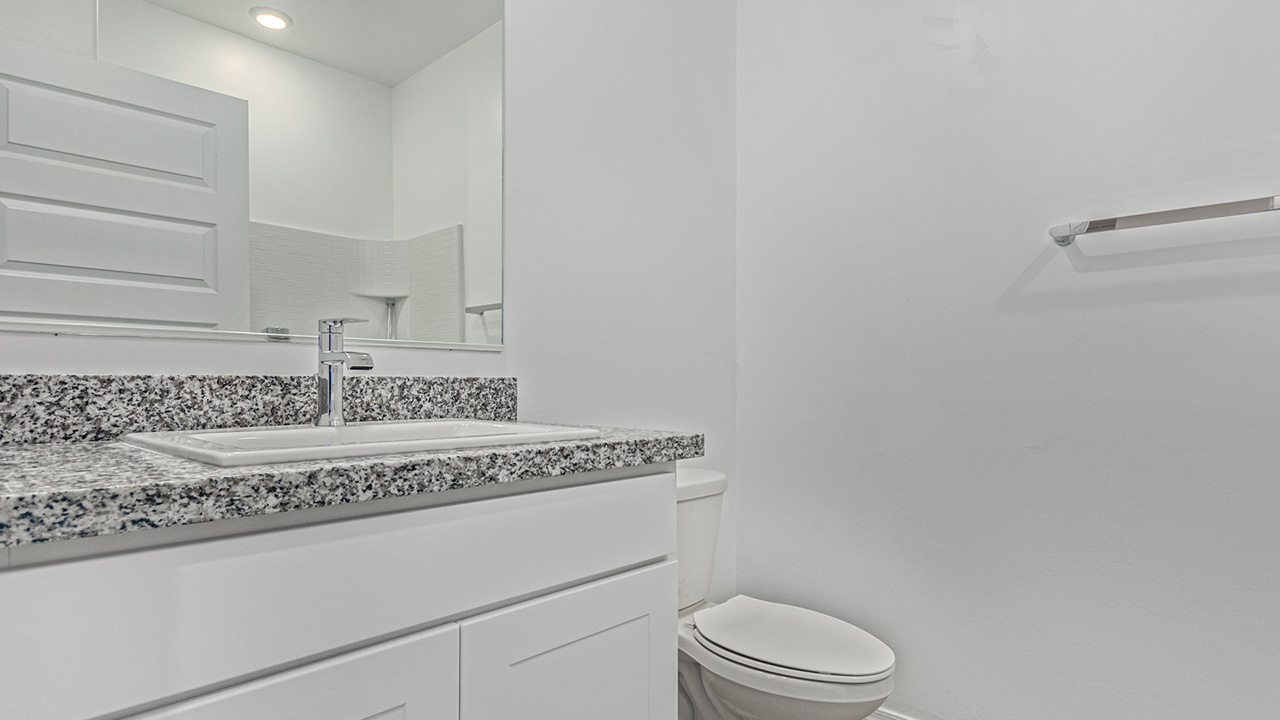 Step into The Baxter at Barnett Village, Marana, Arizona – a beautifully designed 1,423 sq. ft. single-story new home that seamlessly blends modern comfort with thoughtful functionality.  As you enter through the welcoming front porch, you're greeted by an inviting entryway that leads directly into the heart of the home – a spacious and open-concept great room. This area flows effortlessly into the dining space, creating an ideal setting for family gatherings and entertaining guests.  The gourmet kitchen, adjacent to the dining room, features elegant granite countertops, a large island with a breakfast bar, and a walk-in pantry. It’s a space where culinary creativity meets convenience, complete with modern appliances and plenty of storage.  Tucked away in the rear of the home is the master suite, offering privacy and comfort. The suite includes a generous walk-in closet and a luxurious en-suite bathroom with dual vanities and a walk-in shower. Large windows let in plenty of natural light, creating a serene retreat within the home.  Two additional bedrooms are located toward the front of the house, each with easy access to a full bathroom. These rooms are perfect for family, guests, or even a home office.  The Baxter also boasts a covered patio, perfect for enjoying Arizona’s beautiful desert evenings. Whether it’s morning coffee or evening relaxation, this outdoor space extends your living area into the serene landscape of Barnett Village.  With a two-car garage and energy-efficient features that include DOE Zero Energy Ready Home certification, The Baxter at Barnett Village offers not just a home, but a lifestyle that emphasizes comfort, sustainability, and convenience.