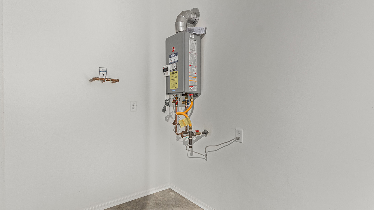 Step into The Baxter at Barnett Village, Marana, Arizona – a beautifully designed 1,423 sq. ft. single-story new home that seamlessly blends modern comfort with thoughtful functionality.  As you enter through the welcoming front porch, you're greeted by an inviting entryway that leads directly into the heart of the home – a spacious and open-concept great room. This area flows effortlessly into the dining space, creating an ideal setting for family gatherings and entertaining guests.  The gourmet kitchen, adjacent to the dining room, features elegant granite countertops, a large island with a breakfast bar, and a walk-in pantry. It’s a space where culinary creativity meets convenience, complete with modern appliances and plenty of storage.  Tucked away in the rear of the home is the master suite, offering privacy and comfort. The suite includes a generous walk-in closet and a luxurious en-suite bathroom with dual vanities and a walk-in shower. Large windows let in plenty of natural light, creating a serene retreat within the home.  Two additional bedrooms are located toward the front of the house, each with easy access to a full bathroom. These rooms are perfect for family, guests, or even a home office.  The Baxter also boasts a covered patio, perfect for enjoying Arizona’s beautiful desert evenings. Whether it’s morning coffee or evening relaxation, this outdoor space extends your living area into the serene landscape of Barnett Village.  With a two-car garage and energy-efficient features that include DOE Zero Energy Ready Home certification, The Baxter at Barnett Village offers not just a home, but a lifestyle that emphasizes comfort, sustainability, and convenience.