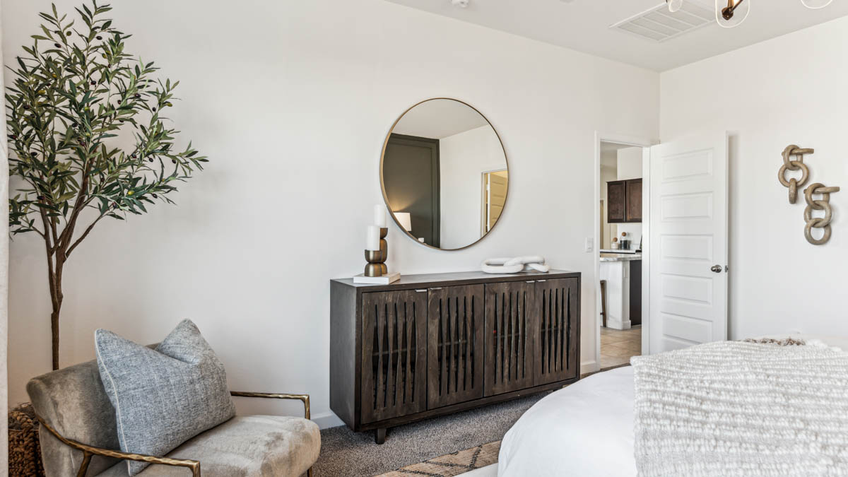 Explore The Dalton at Barnett Village in Marana, Arizona – a spacious 1,569 sq. ft. single-story new home designed to accommodate both comfort and convenience for modern living.  As you step through the front porch and into the welcoming entryway, you're immediately led into a thoughtfully designed space that maximizes every square foot. To the left, you’ll find Bedroom 4, ideal for guests or a home office, offering privacy and easy access to the main living areas.  Continuing through the home, you’ll enter the heart of The Dalton – an expansive great room that seamlessly connects to the dining area and kitchen. This open-concept space is perfect for entertaining or everyday family living, allowing for a fluid transition from cooking to dining to relaxation. The kitchen is equipped with sleek granite countertops, modern appliances, a walk-in pantry, and an island that doubles as a breakfast bar, providing ample space for meal prep and casual dining.  Adjacent to the great room, a hallway leads to three additional bedrooms, including the spacious master suite. The master bedroom offers a serene retreat with a large walk-in closet and an en-suite bathroom featuring dual vanities and a walk-in shower. The two secondary bedrooms share a well-appointed full bathroom, making it convenient for family members or guests.  The Dalton also includes a utility room that adds functionality and storage options to the home, as well as direct access to a two-car garage.  Step outside from the great room to the covered patio – a perfect spot to enjoy Arizona’s beautiful weather year-round, whether you’re sipping your morning coffee or hosting an evening barbecue.  Designed with energy efficiency in mind, The Dalton at Barnett Village is DOE Zero Energy Ready Home certified, ensuring long-term savings and a comfortable living environment.  *Images shown are for reference only. They depict the Dalton model home and may not represent the actual home.