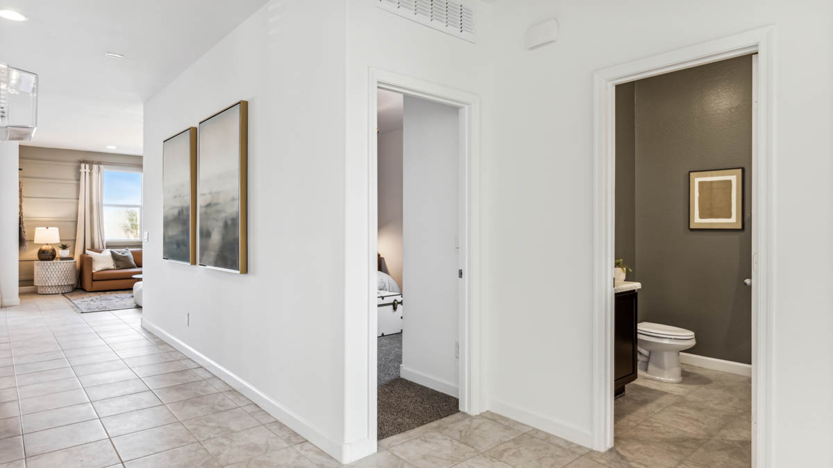 Explore The Dalton at Barnett Village in Marana, Arizona – a spacious 1,569 sq. ft. single-story new home designed to accommodate both comfort and convenience for modern living.  As you step through the front porch and into the welcoming entryway, you're immediately led into a thoughtfully designed space that maximizes every square foot. To the left, you’ll find Bedroom 4, ideal for guests or a home office, offering privacy and easy access to the main living areas.  Continuing through the home, you’ll enter the heart of The Dalton – an expansive great room that seamlessly connects to the dining area and kitchen. This open-concept space is perfect for entertaining or everyday family living, allowing for a fluid transition from cooking to dining to relaxation. The kitchen is equipped with sleek granite countertops, modern appliances, a walk-in pantry, and an island that doubles as a breakfast bar, providing ample space for meal prep and casual dining.  Adjacent to the great room, a hallway leads to three additional bedrooms, including the spacious master suite. The master bedroom offers a serene retreat with a large walk-in closet and an en-suite bathroom featuring dual vanities and a walk-in shower. The two secondary bedrooms share a well-appointed full bathroom, making it convenient for family members or guests.  The Dalton also includes a utility room that adds functionality and storage options to the home, as well as direct access to a two-car garage.  Step outside from the great room to the covered patio – a perfect spot to enjoy Arizona’s beautiful weather year-round, whether you’re sipping your morning coffee or hosting an evening barbecue.  Designed with energy efficiency in mind, The Dalton at Barnett Village is DOE Zero Energy Ready Home certified, ensuring long-term savings and a comfortable living environment.  *Images shown are for reference only. They depict the Dalton model home and may not represent the actual home.