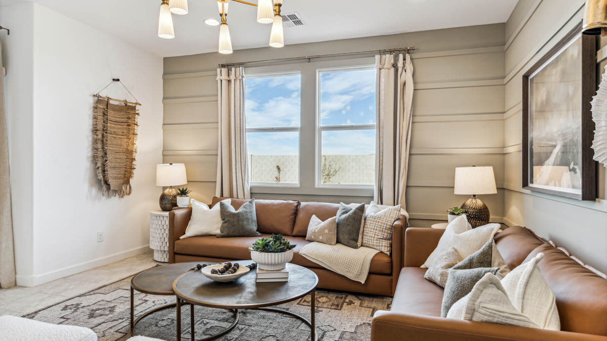 Explore The Dalton at Barnett Village in Marana, Arizona – a spacious 1,569 sq. ft. single-story new home designed to accommodate both comfort and convenience for modern living.  As you step through the front porch and into the welcoming entryway, you're immediately led into a thoughtfully designed space that maximizes every square foot. To the left, you’ll find Bedroom 4, ideal for guests or a home office, offering privacy and easy access to the main living areas.  Continuing through the home, you’ll enter the heart of The Dalton – an expansive great room that seamlessly connects to the dining area and kitchen. This open-concept space is perfect for entertaining or everyday family living, allowing for a fluid transition from cooking to dining to relaxation. The kitchen is equipped with sleek granite countertops, modern appliances, a walk-in pantry, and an island that doubles as a breakfast bar, providing ample space for meal prep and casual dining.  Adjacent to the great room, a hallway leads to three additional bedrooms, including the spacious master suite. The master bedroom offers a serene retreat with a large walk-in closet and an en-suite bathroom featuring dual vanities and a walk-in shower. The two secondary bedrooms share a well-appointed full bathroom, making it convenient for family members or guests.  The Dalton also includes a utility room that adds functionality and storage options to the home, as well as direct access to a two-car garage.  Step outside from the great room to the covered patio – a perfect spot to enjoy Arizona’s beautiful weather year-round, whether you’re sipping your morning coffee or hosting an evening barbecue.  Designed with energy efficiency in mind, The Dalton at Barnett Village is DOE Zero Energy Ready Home certified, ensuring long-term savings and a comfortable living environment.  *Images shown are for reference only. They depict the Dalton model home and may not represent the actual home.