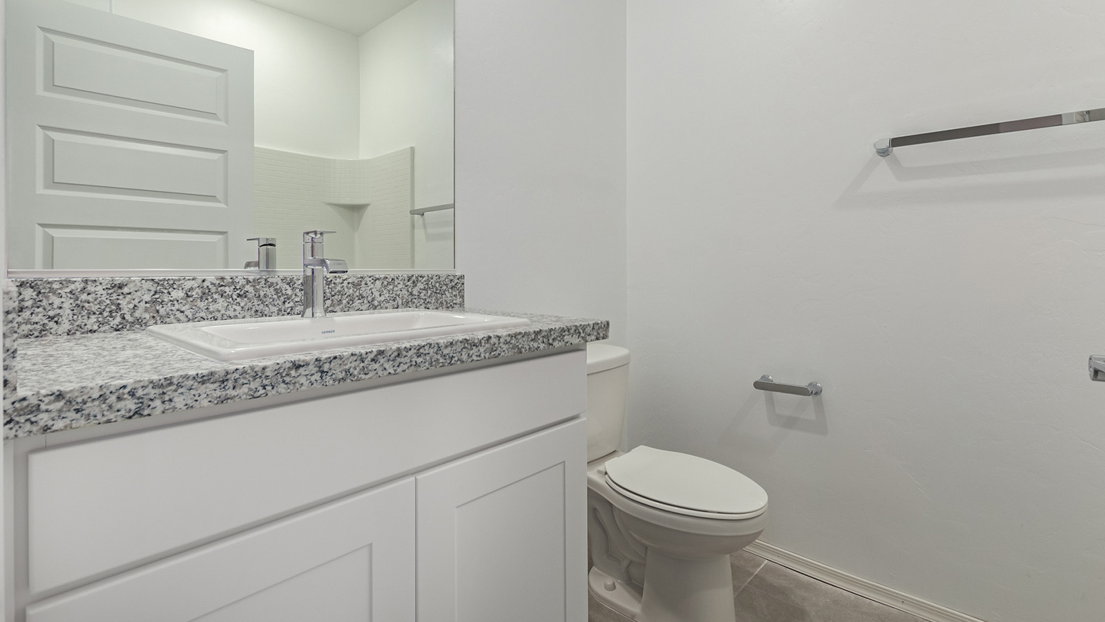 Discover The Easton at Barnett Village in Marana, Arizona – a spacious 1,701 sq. ft. single-story new home designed to offer both style and functionality for today’s modern family.  As you enter through the charming front porch, you’re welcomed into a thoughtful layout that makes every square foot count. Situated near the entrance you'll find the first bedroom, offering flexibility as a guest room, home office, or a cozy retreat.  Continuing down the hall, you’re led into the expansive great room, which flows seamlessly into the dining area and kitchen. This open-concept design ensures that the heart of the home is always connected, whether you’re preparing meals, dining, or relaxing with loved ones. The kitchen features sleek quartz countertops, a spacious center island, modern appliances, and a walk-in pantry that offers ample storage for all your cooking essentials.  The great room opens up to a covered patio, an ideal space to unwind and enjoy Arizona’s beautiful desert sunsets. Whether you’re hosting a weekend barbecue or enjoying a quiet evening outdoors, this patio extends your living space into the scenic surroundings of Barnett Village.  Just off the great room, a private hallway leads to the primary bedroom, which is a true retreat within the home. The primary suite is generously sized and includes a large walk-in closet and an en-suite bathroom, offering both luxury and convenience.   The Easton also features two additional bedrooms, well-positioned to share a full bathroom. These rooms are ideal for family members, providing comfortable living spaces with plenty of natural light.  For added convenience, the home includes a utility room and direct access to a two-car garage, making daily routines smoother and more efficient.  Designed with energy efficiency in mind, The Easton at Barnett Village is DOE Zero Energy Ready Home certified, ensuring both sustainability and savings.