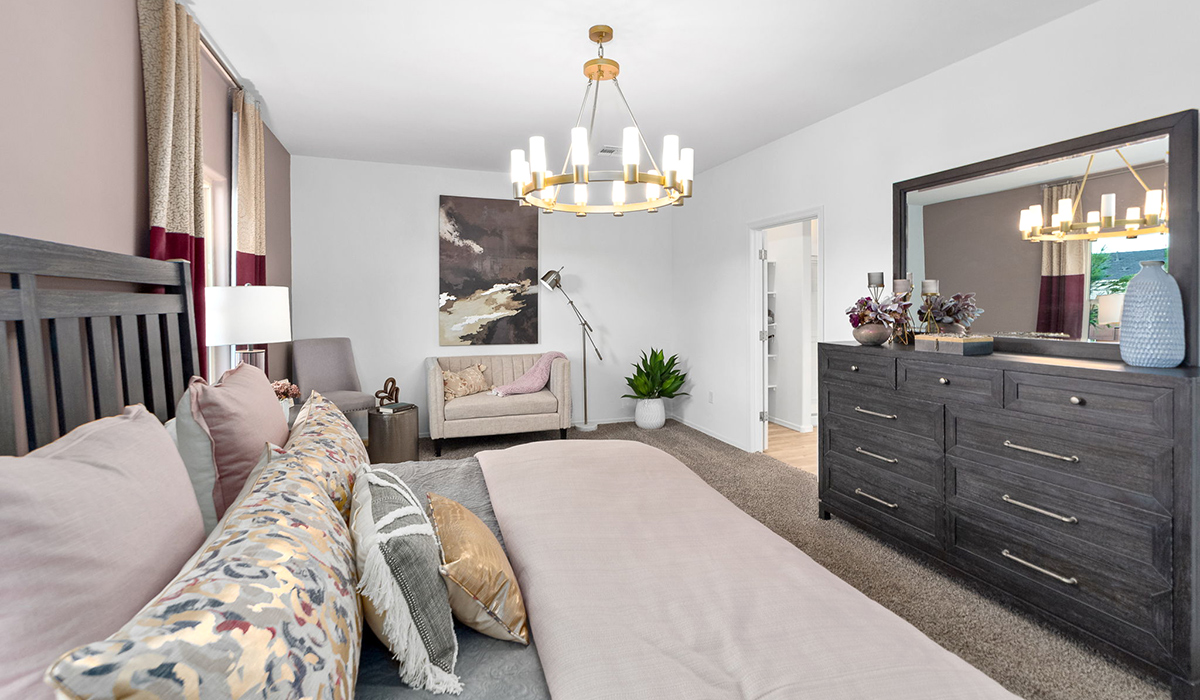 Welcome to The Harris at Barnett Village in Marana, Arizona – our beautifully designed home, offering 1,856 sq. ft. of modern living space that combines elegance with functionality.  Step through the inviting front porch and into a thoughtfully planned interior that begins with a welcoming entryway. This home features two of the four bedrooms near the entrance of the home, both sharing easy access to a full bathroom. These rooms are perfect for guests, children, or even a home office, providing comfort for various lifestyle needs.  As you continue through the spacious great room is revealed, the central hub of the home that seamlessly connects to the dining area and kitchen. The kitchen is a chef’s delight, complete with quartz countertops, large island with a breakfast bar, walk-in pantry, and state-of-the-art appliances.  Adjacent to the great room, a private hallway leads to the primary suite – a tranquil retreat within the home. The primary bedroom features a large walk-in closet and en-suite bathroom. Additionally, the suite offers direct access to a powder room, enhancing the convenience and privacy of this luxurious space.  The Harris also includes a utility room and a two-car garage adding to the home’s practical features, ensuring that daily routines are smooth and efficient.  Step outside to the covered patio, where you can unwind and take in the scenic beauty of Barnett Village. Whether you’re enjoying a quiet morning coffee or hosting a lively evening gathering, this outdoor space extends your living area and provides the perfect backdrop for Arizona’s desert landscapes.  Designed with energy efficiency, The Harris at Barnett Village is DOE Zero Energy Ready Home certified.  *Images shown are for reference only. They depict the sales model home and may not represent the actual home.