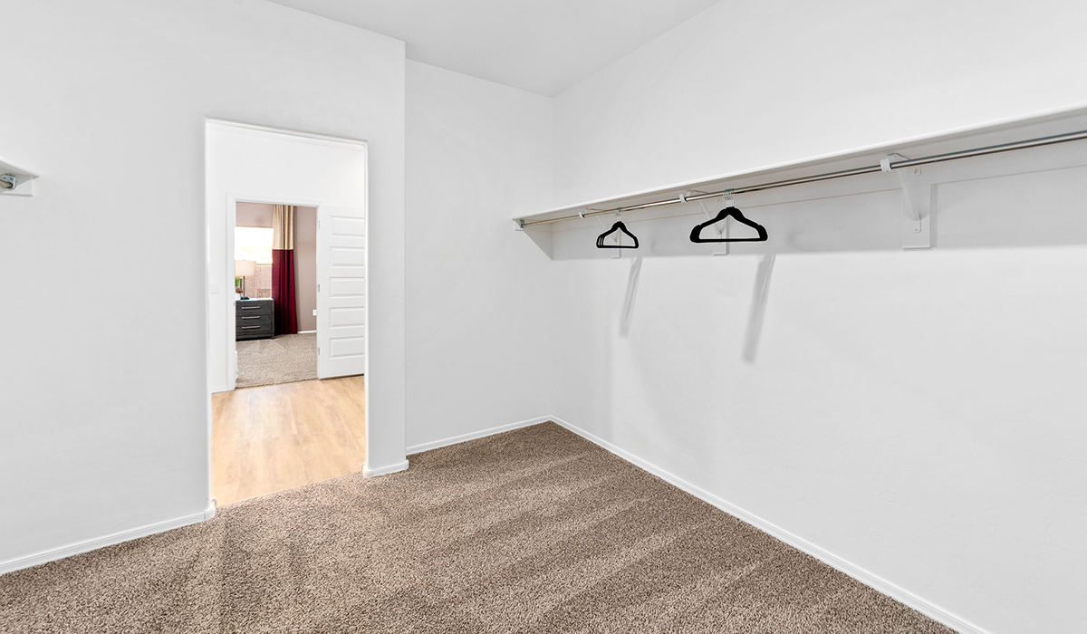 Welcome to The Harris at Barnett Village in Marana, Arizona – our beautifully designed home, offering 1,856 sq. ft. of modern living space that combines elegance with functionality.  Step through the inviting front porch and into a thoughtfully planned interior that begins with a welcoming entryway. This home features two of the four bedrooms near the entrance of the home, both sharing easy access to a full bathroom. These rooms are perfect for guests, children, or even a home office, providing comfort for various lifestyle needs.  As you continue through the spacious great room is revealed, the central hub of the home that seamlessly connects to the dining area and kitchen. The kitchen is a chef’s delight, complete with quartz countertops, large island with a breakfast bar, walk-in pantry, and state-of-the-art appliances.  Adjacent to the great room, a private hallway leads to the primary suite – a tranquil retreat within the home. The primary bedroom features a large walk-in closet and en-suite bathroom. Additionally, the suite offers direct access to a powder room, enhancing the convenience and privacy of this luxurious space.  The Harris also includes a utility room and a two-car garage adding to the home’s practical features, ensuring that daily routines are smooth and efficient.  Step outside to the covered patio, where you can unwind and take in the scenic beauty of Barnett Village. Whether you’re enjoying a quiet morning coffee or hosting a lively evening gathering, this outdoor space extends your living area and provides the perfect backdrop for Arizona’s desert landscapes.  Designed with energy efficiency, The Harris at Barnett Village is DOE Zero Energy Ready Home certified.  *Images shown are for reference only. They depict the sales model home and may not represent the actual home.