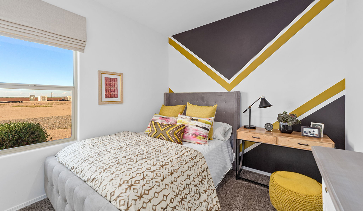 Welcome to The Harris at Barnett Village in Marana, Arizona – our beautifully designed home, offering 1,856 sq. ft. of modern living space that combines elegance with functionality.  Step through the inviting front porch and into a thoughtfully planned interior that begins with a welcoming entryway. This home features two of the four bedrooms near the entrance of the home, both sharing easy access to a full bathroom. These rooms are perfect for guests, children, or even a home office, providing comfort for various lifestyle needs.  As you continue through the spacious great room is revealed, the central hub of the home that seamlessly connects to the dining area and kitchen. The kitchen is a chef’s delight, complete with quartz countertops, large island with a breakfast bar, walk-in pantry, and state-of-the-art appliances.  Adjacent to the great room, a private hallway leads to the primary suite – a tranquil retreat within the home. The primary bedroom features a large walk-in closet and en-suite bathroom. Additionally, the suite offers direct access to a powder room, enhancing the convenience and privacy of this luxurious space.  The Harris also includes a utility room and a two-car garage adding to the home’s practical features, ensuring that daily routines are smooth and efficient.  Step outside to the covered patio, where you can unwind and take in the scenic beauty of Barnett Village. Whether you’re enjoying a quiet morning coffee or hosting a lively evening gathering, this outdoor space extends your living area and provides the perfect backdrop for Arizona’s desert landscapes.  Designed with energy efficiency, The Harris at Barnett Village is DOE Zero Energy Ready Home certified.  *Images shown are for reference only. They depict the sales model home and may not represent the actual home.