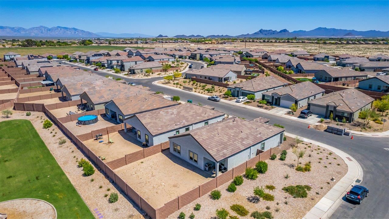 Explore The Denton at Barnett Village in Marana, Arizona – a spacious 1,615 sq. ft. single-story home designed to accommodate both comfort and convenience for modern living.  As you step through the front porch and into the welcoming entryway, you're immediately led into a thoughtfully designed space that maximizes every square foot. Near the front of the home, you’ll find two bedrooms and full bathroom.  Continuing through the home, you’ll enter the heart of The Denton – an expansive great room that seamlessly connects to the dining area and kitchen area. This open-concept space is perfect for entertaining or everyday family living, allowing for a fluid transition from cooking to dining to relaxation. The kitchen is equipped with sleek quartz countertops, modern appliances, a walk-in pantry, and an island that doubles as a breakfast bar, providing ample space for meal prep and casual dining.  Adjacent to the great room, you find the primary suite sanctuary with a large walk-in closet and an en-suite bathroom.   The Denton also includes a utility room that adds functionality and storage options to the home, as well as direct access to a two-car garage.  Step outside from the great room to the covered patio – a perfect spot to enjoy Arizona’s beautiful weather year-round, whether you’re sipping your morning coffee or hosting an evening barbecue.  Designed with energy efficiency in mind, The Dalton at Barnett Village is DOE Zero Energy Ready Home certified, ensuring long-term savings and a comfortable living environment.