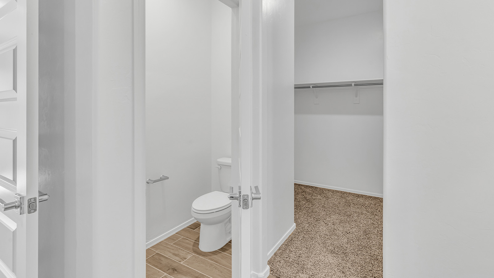 Step into The Cali at Barnett Village, Marana, Arizona – a perfect blend of comfort, modern living, and energy efficiency. This thoughtfully crafted one-story home spans 1,825 square feet and offers ample space featuring 4 bedrooms and 2 bathrooms, ideal for families of all sizes.  As you step through the front porch and into the welcoming entryway, you're immediately led into a thoughtfully designed space that maximizes every square foot. Near the entrance of the home you’ll find 2 bedrooms, ideal for guests or a home office, offering privacy and easy access to the main living areas.  Continuing through the home, you’ll enter the heart of The Cali – an expansive great room that seamlessly connects to the dining area and kitchen. This open-concept space is perfect for entertaining or everyday family living, allowing for a fluid transition from cooking to dining to relaxation. The kitchen is equipped with sleek quartz countertops, modern appliances, a pantry, and an island that doubles as a breakfast bar, providing ample space for meal prep and casual dining.  The primary bedroom, located at the rear of the home, provides a peaceful retreat with a private ensuite bathroom and a generous walk-in closet. The additional four bedrooms are positioned at the front of the house, offering versatility for use as guest rooms, a home office, or children’s bedrooms.  The Cali floor plan offers the option of an extended covered back patio. Whether it’s morning coffee or evening relaxation, this outdoor space extends your living area into the serene landscape of Barnett Village.  Designed with energy efficiency in mind, The Cali at Barnett Village is DOE Zero Energy Ready Home certified, ensuring long-term savings and a comfortable living environment.