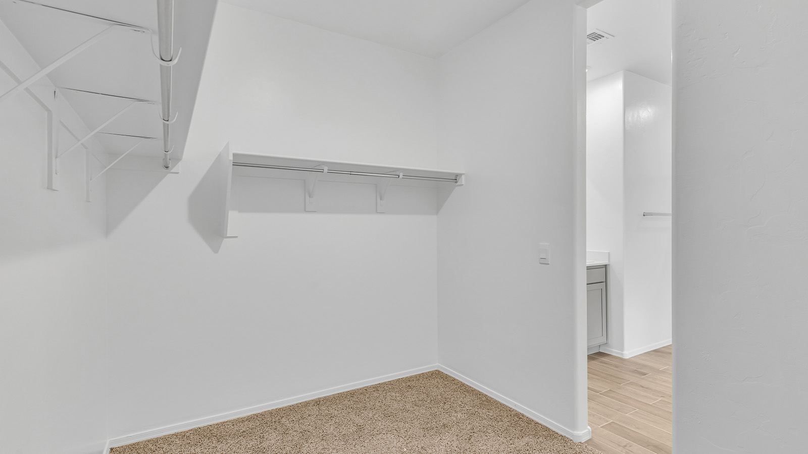 Step into The Cali at Barnett Village, Marana, Arizona – a perfect blend of comfort, modern living, and energy efficiency. This thoughtfully crafted one-story home spans 1,825 square feet and offers ample space featuring 4 bedrooms and 2 bathrooms, ideal for families of all sizes.  As you step through the front porch and into the welcoming entryway, you're immediately led into a thoughtfully designed space that maximizes every square foot. Near the entrance of the home you’ll find 2 bedrooms, ideal for guests or a home office, offering privacy and easy access to the main living areas.  Continuing through the home, you’ll enter the heart of The Cali – an expansive great room that seamlessly connects to the dining area and kitchen. This open-concept space is perfect for entertaining or everyday family living, allowing for a fluid transition from cooking to dining to relaxation. The kitchen is equipped with sleek quartz countertops, modern appliances, a pantry, and an island that doubles as a breakfast bar, providing ample space for meal prep and casual dining.  The primary bedroom, located at the rear of the home, provides a peaceful retreat with a private ensuite bathroom and a generous walk-in closet. The additional four bedrooms are positioned at the front of the house, offering versatility for use as guest rooms, a home office, or children’s bedrooms.  The Cali floor plan offers the option of an extended covered back patio. Whether it’s morning coffee or evening relaxation, this outdoor space extends your living area into the serene landscape of Barnett Village.  Designed with energy efficiency in mind, The Cali at Barnett Village is DOE Zero Energy Ready Home certified, ensuring long-term savings and a comfortable living environment.