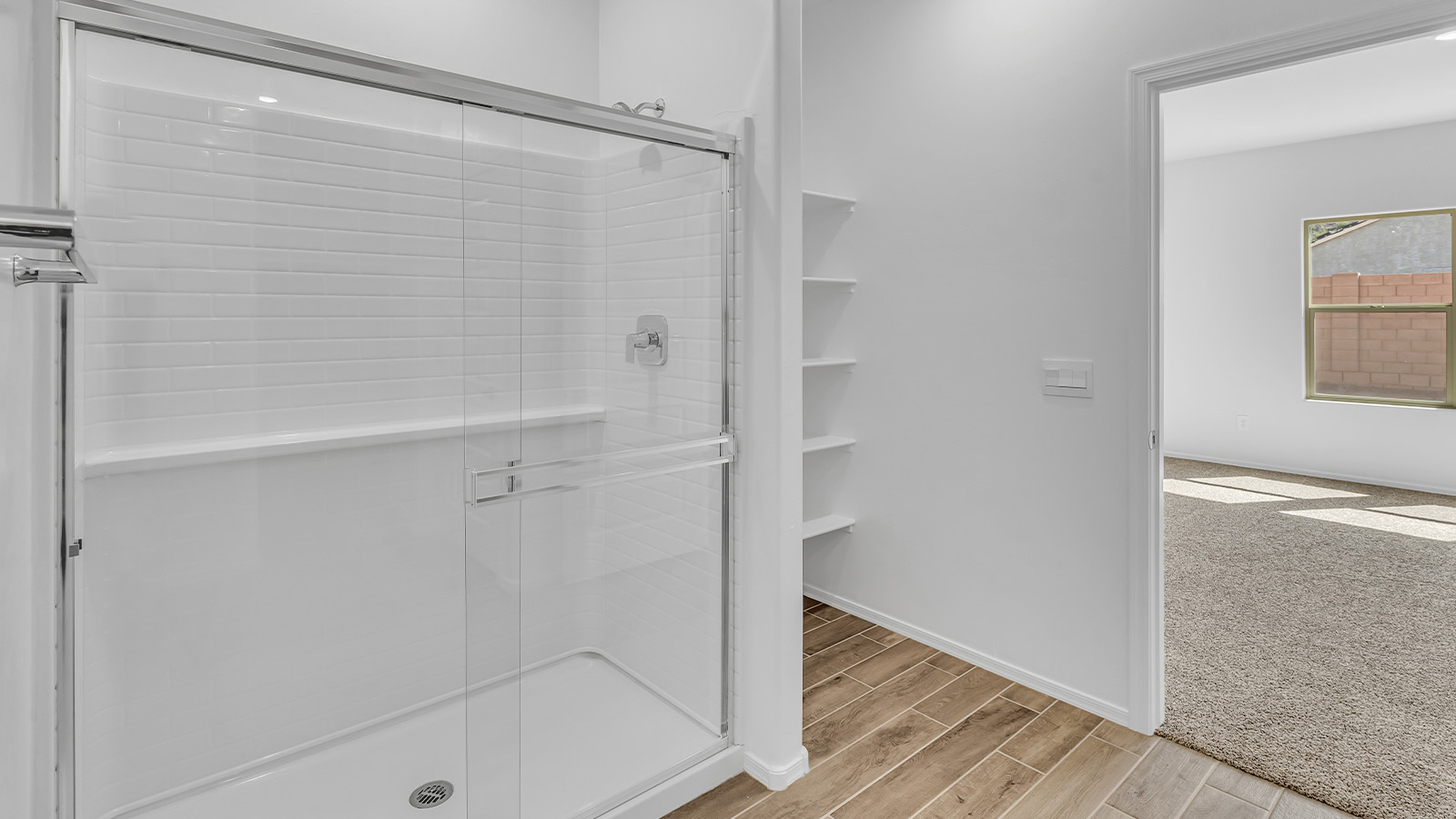 Step into The Cali at Barnett Village, Marana, Arizona – a perfect blend of comfort, modern living, and energy efficiency. This thoughtfully crafted one-story home spans 1,825 square feet and offers ample space featuring 4 bedrooms and 2 bathrooms, ideal for families of all sizes.  As you step through the front porch and into the welcoming entryway, you're immediately led into a thoughtfully designed space that maximizes every square foot. Near the entrance of the home you’ll find 2 bedrooms, ideal for guests or a home office, offering privacy and easy access to the main living areas.  Continuing through the home, you’ll enter the heart of The Cali – an expansive great room that seamlessly connects to the dining area and kitchen. This open-concept space is perfect for entertaining or everyday family living, allowing for a fluid transition from cooking to dining to relaxation. The kitchen is equipped with sleek quartz countertops, modern appliances, a pantry, and an island that doubles as a breakfast bar, providing ample space for meal prep and casual dining.  The primary bedroom, located at the rear of the home, provides a peaceful retreat with a private ensuite bathroom and a generous walk-in closet. The additional four bedrooms are positioned at the front of the house, offering versatility for use as guest rooms, a home office, or children’s bedrooms.  The Cali floor plan offers the option of an extended covered back patio. Whether it’s morning coffee or evening relaxation, this outdoor space extends your living area into the serene landscape of Barnett Village.  Designed with energy efficiency in mind, The Cali at Barnett Village is DOE Zero Energy Ready Home certified, ensuring long-term savings and a comfortable living environment.