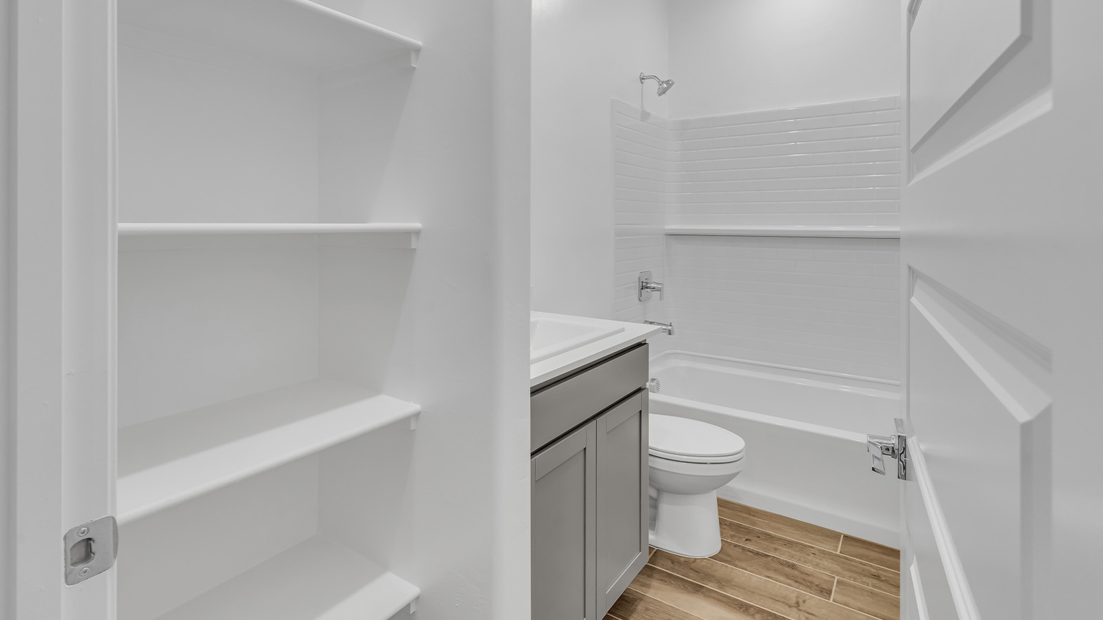 Step into The Cali at Barnett Village, Marana, Arizona – a perfect blend of comfort, modern living, and energy efficiency. This thoughtfully crafted one-story home spans 1,825 square feet and offers ample space featuring 4 bedrooms and 2 bathrooms, ideal for families of all sizes.  As you step through the front porch and into the welcoming entryway, you're immediately led into a thoughtfully designed space that maximizes every square foot. Near the entrance of the home you’ll find 2 bedrooms, ideal for guests or a home office, offering privacy and easy access to the main living areas.  Continuing through the home, you’ll enter the heart of The Cali – an expansive great room that seamlessly connects to the dining area and kitchen. This open-concept space is perfect for entertaining or everyday family living, allowing for a fluid transition from cooking to dining to relaxation. The kitchen is equipped with sleek quartz countertops, modern appliances, a pantry, and an island that doubles as a breakfast bar, providing ample space for meal prep and casual dining.  The primary bedroom, located at the rear of the home, provides a peaceful retreat with a private ensuite bathroom and a generous walk-in closet. The additional four bedrooms are positioned at the front of the house, offering versatility for use as guest rooms, a home office, or children’s bedrooms.  The Cali floor plan offers the option of an extended covered back patio. Whether it’s morning coffee or evening relaxation, this outdoor space extends your living area into the serene landscape of Barnett Village.  Designed with energy efficiency in mind, The Cali at Barnett Village is DOE Zero Energy Ready Home certified, ensuring long-term savings and a comfortable living environment.