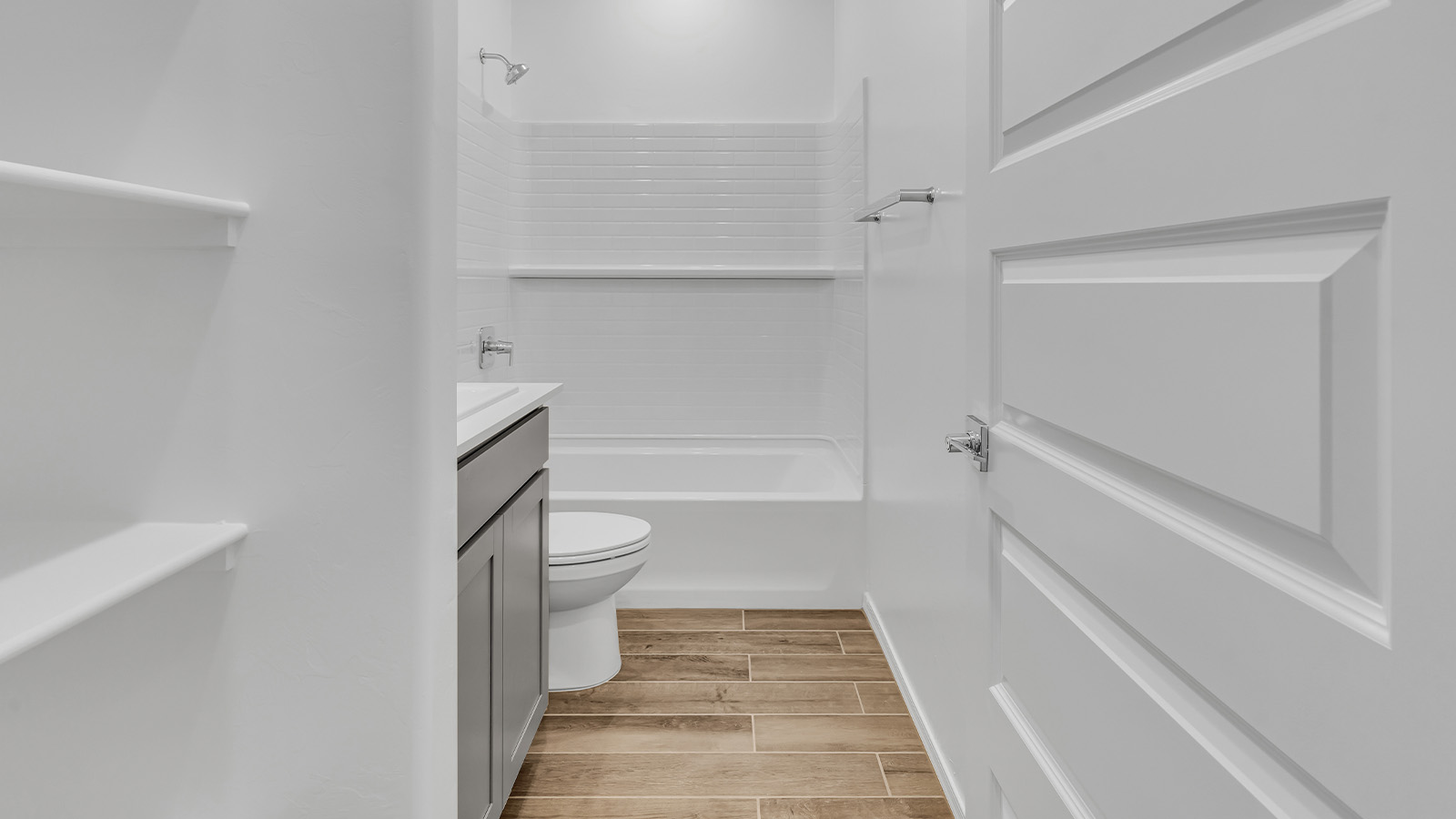 Step into The Cali at Barnett Village, Marana, Arizona – a perfect blend of comfort, modern living, and energy efficiency. This thoughtfully crafted one-story home spans 1,825 square feet and offers ample space featuring 4 bedrooms and 2 bathrooms, ideal for families of all sizes.  As you step through the front porch and into the welcoming entryway, you're immediately led into a thoughtfully designed space that maximizes every square foot. Near the entrance of the home you’ll find 2 bedrooms, ideal for guests or a home office, offering privacy and easy access to the main living areas.  Continuing through the home, you’ll enter the heart of The Cali – an expansive great room that seamlessly connects to the dining area and kitchen. This open-concept space is perfect for entertaining or everyday family living, allowing for a fluid transition from cooking to dining to relaxation. The kitchen is equipped with sleek quartz countertops, modern appliances, a pantry, and an island that doubles as a breakfast bar, providing ample space for meal prep and casual dining.  The primary bedroom, located at the rear of the home, provides a peaceful retreat with a private ensuite bathroom and a generous walk-in closet. The additional four bedrooms are positioned at the front of the house, offering versatility for use as guest rooms, a home office, or children’s bedrooms.  The Cali floor plan offers the option of an extended covered back patio. Whether it’s morning coffee or evening relaxation, this outdoor space extends your living area into the serene landscape of Barnett Village.  Designed with energy efficiency in mind, The Cali at Barnett Village is DOE Zero Energy Ready Home certified, ensuring long-term savings and a comfortable living environment.