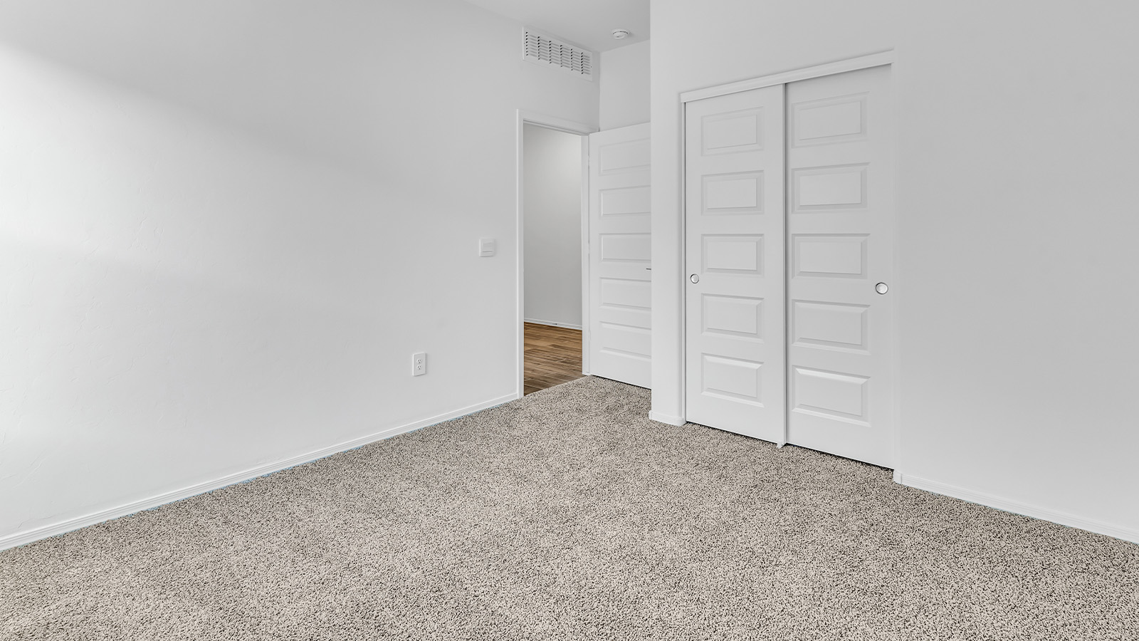 Step into The Cali at Barnett Village, Marana, Arizona – a perfect blend of comfort, modern living, and energy efficiency. This thoughtfully crafted one-story home spans 1,825 square feet and offers ample space featuring 4 bedrooms and 2 bathrooms, ideal for families of all sizes.  As you step through the front porch and into the welcoming entryway, you're immediately led into a thoughtfully designed space that maximizes every square foot. Near the entrance of the home you’ll find 2 bedrooms, ideal for guests or a home office, offering privacy and easy access to the main living areas.  Continuing through the home, you’ll enter the heart of The Cali – an expansive great room that seamlessly connects to the dining area and kitchen. This open-concept space is perfect for entertaining or everyday family living, allowing for a fluid transition from cooking to dining to relaxation. The kitchen is equipped with sleek quartz countertops, modern appliances, a pantry, and an island that doubles as a breakfast bar, providing ample space for meal prep and casual dining.  The primary bedroom, located at the rear of the home, provides a peaceful retreat with a private ensuite bathroom and a generous walk-in closet. The additional four bedrooms are positioned at the front of the house, offering versatility for use as guest rooms, a home office, or children’s bedrooms.  The Cali floor plan offers the option of an extended covered back patio. Whether it’s morning coffee or evening relaxation, this outdoor space extends your living area into the serene landscape of Barnett Village.  Designed with energy efficiency in mind, The Cali at Barnett Village is DOE Zero Energy Ready Home certified, ensuring long-term savings and a comfortable living environment.