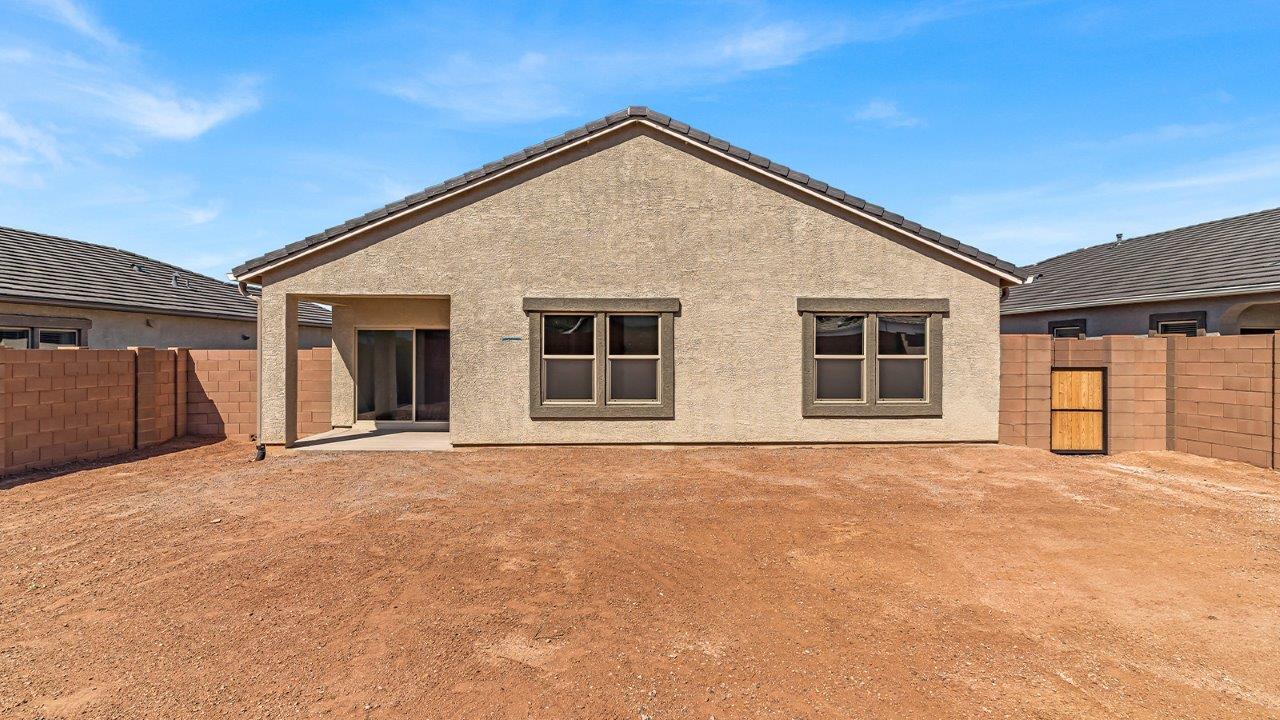 Step into The Cali at Barnett Village, Marana, Arizona – a perfect blend of comfort, modern living, and energy efficiency. This thoughtfully crafted one-story home spans 1,825 square feet and offers ample space featuring 4 bedrooms and 2 bathrooms, ideal for families of all sizes.  As you step through the front porch and into the welcoming entryway, you're immediately led into a thoughtfully designed space that maximizes every square foot. Near the entrance of the home you’ll find 2 bedrooms, ideal for guests or a home office, offering privacy and easy access to the main living areas.  Continuing through the home, you’ll enter the heart of The Cali – an expansive great room that seamlessly connects to the dining area and kitchen. This open-concept space is perfect for entertaining or everyday family living, allowing for a fluid transition from cooking to dining to relaxation. The kitchen is equipped with sleek quartz countertops, modern appliances, a pantry, and an island that doubles as a breakfast bar, providing ample space for meal prep and casual dining.  The primary bedroom, located at the rear of the home, provides a peaceful retreat with a private ensuite bathroom and a generous walk-in closet. The additional four bedrooms are positioned at the front of the house, offering versatility for use as guest rooms, a home office, or children’s bedrooms.  The Cali floor plan offers the option of an extended covered back patio. Whether it’s morning coffee or evening relaxation, this outdoor space extends your living area into the serene landscape of Barnett Village.  Designed with energy efficiency in mind, The Cali at Barnett Village is DOE Zero Energy Ready Home certified, ensuring long-term savings and a comfortable living environment.