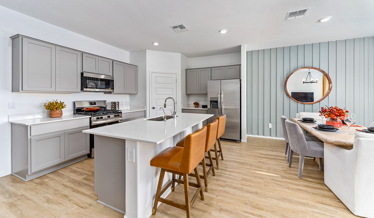 Step into The Cali at Barnett Village, Marana, Arizona – a perfect blend of comfort, modern living, and energy efficiency. This thoughtfully crafted one-story home spans 1,825 square feet and offers ample space featuring 4 bedrooms and 2 bathrooms, ideal for families of all sizes.  As you step through the front porch and into the welcoming entryway, you're immediately led into a thoughtfully designed space that maximizes every square foot. Near the entrance of the home you’ll find 2 bedrooms, ideal for guests or a home office, offering privacy and easy access to the main living areas.  Continuing through the home, you’ll enter the heart of The Cali – an expansive great room that seamlessly connects to the dining area and kitchen. This open-concept space is perfect for entertaining or everyday family living, allowing for a fluid transition from cooking to dining to relaxation. The kitchen is equipped with sleek quartz countertops, modern appliances, a pantry, and an island that doubles as a breakfast bar, providing ample space for meal prep and casual dining.  The primary bedroom, located at the rear of the home, provides a peaceful retreat with a private ensuite bathroom and a generous walk-in closet. The additional four bedrooms are positioned at the front of the house, offering versatility for use as guest rooms, a home office, or children’s bedrooms.  The Cali floor plan offers the option of an extended covered back patio. Whether it’s morning coffee or evening relaxation, this outdoor space extends your living area into the serene landscape of Barnett Village.  Explore The Cali at Barnett Village today and discover a community where you can truly thrive.  *Images shown are for reference only. They depict The Cali sales model home and may not represent the actual home.