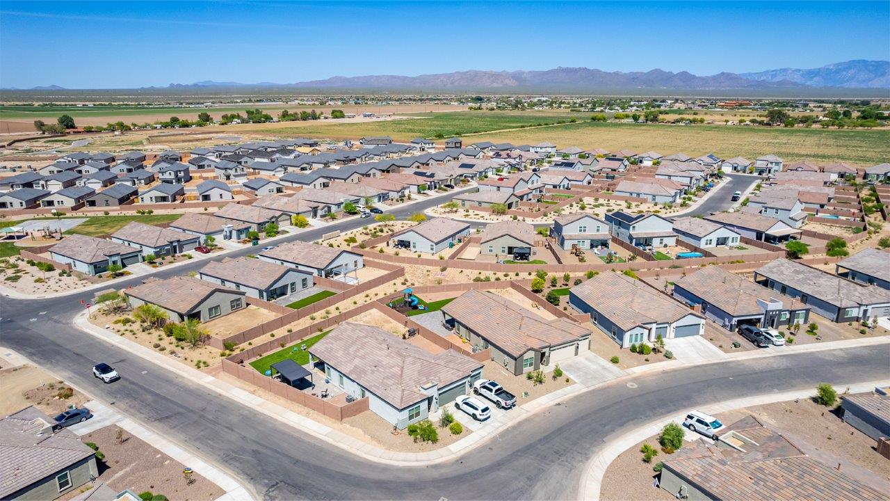 Step into The Cali at Barnett Village, Marana, Arizona – a perfect blend of comfort, modern living, and energy efficiency. This thoughtfully crafted one-story home spans 1,825 square feet and offers ample space featuring 4 bedrooms and 2 bathrooms, ideal for families of all sizes.  As you step through the front porch and into the welcoming entryway, you're immediately led into a thoughtfully designed space that maximizes every square foot. Near the entrance of the home you’ll find 2 bedrooms, ideal for guests or a home office, offering privacy and easy access to the main living areas.  Continuing through the home, you’ll enter the heart of The Cali – an expansive great room that seamlessly connects to the dining area and kitchen. This open-concept space is perfect for entertaining or everyday family living, allowing for a fluid transition from cooking to dining to relaxation. The kitchen is equipped with sleek quartz countertops, modern appliances, a pantry, and an island that doubles as a breakfast bar, providing ample space for meal prep and casual dining.  The primary bedroom, located at the rear of the home, provides a peaceful retreat with a private ensuite bathroom and a generous walk-in closet. The additional four bedrooms are positioned at the front of the house, offering versatility for use as guest rooms, a home office, or children’s bedrooms.  The Cali floor plan offers the option of an extended covered back patio. Whether it’s morning coffee or evening relaxation, this outdoor space extends your living area into the serene landscape of Barnett Village.  Designed with energy efficiency in mind, The Cali at Barnett Village is DOE Zero Energy Ready Home certified, ensuring long-term savings and a comfortable living environment.