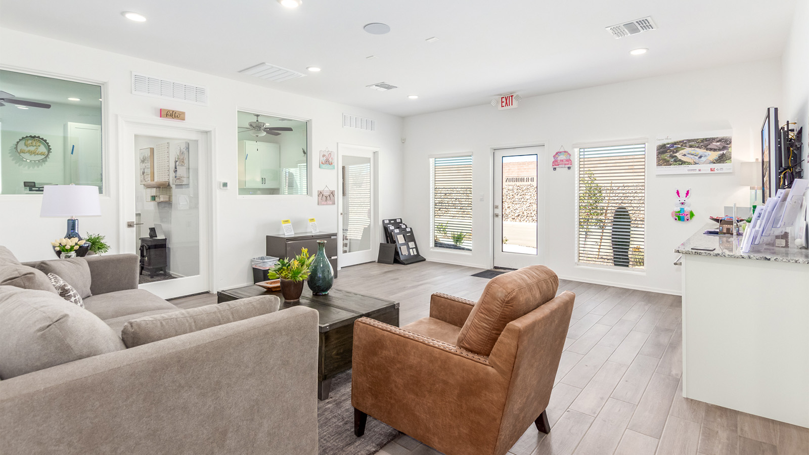 Step into The Cali at Barnett Village, Marana, Arizona – a perfect blend of comfort, modern living, and energy efficiency. This thoughtfully crafted one-story home spans 1,825 square feet and offers ample space featuring 4 bedrooms and 2 bathrooms, ideal for families of all sizes.  As you step through the front porch and into the welcoming entryway, you're immediately led into a thoughtfully designed space that maximizes every square foot. Near the entrance of the home you’ll find 2 bedrooms, ideal for guests or a home office, offering privacy and easy access to the main living areas.  Continuing through the home, you’ll enter the heart of The Cali – an expansive great room that seamlessly connects to the dining area and kitchen. This open-concept space is perfect for entertaining or everyday family living, allowing for a fluid transition from cooking to dining to relaxation. The kitchen is equipped with sleek quartz countertops, modern appliances, a pantry, and an island that doubles as a breakfast bar, providing ample space for meal prep and casual dining.  The primary bedroom, located at the rear of the home, provides a peaceful retreat with a private ensuite bathroom and a generous walk-in closet. The additional four bedrooms are positioned at the front of the house, offering versatility for use as guest rooms, a home office, or children’s bedrooms.  The Cali floor plan offers the option of an extended covered back patio. Whether it’s morning coffee or evening relaxation, this outdoor space extends your living area into the serene landscape of Barnett Village.  Designed with energy efficiency in mind, The Cali at Barnett Village is DOE Zero Energy Ready Home certified, ensuring long-term savings and a comfortable living environment.