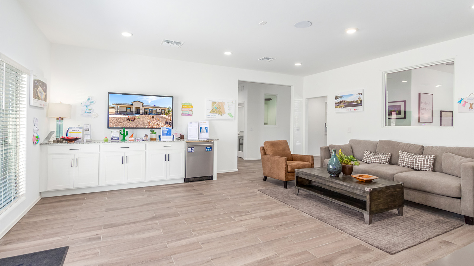 Step into The Cali at Barnett Village, Marana, Arizona – a perfect blend of comfort, modern living, and energy efficiency. This thoughtfully crafted one-story home spans 1,825 square feet and offers ample space featuring 4 bedrooms and 2 bathrooms, ideal for families of all sizes.  As you step through the front porch and into the welcoming entryway, you're immediately led into a thoughtfully designed space that maximizes every square foot. Near the entrance of the home you’ll find 2 bedrooms, ideal for guests or a home office, offering privacy and easy access to the main living areas.  Continuing through the home, you’ll enter the heart of The Cali – an expansive great room that seamlessly connects to the dining area and kitchen. This open-concept space is perfect for entertaining or everyday family living, allowing for a fluid transition from cooking to dining to relaxation. The kitchen is equipped with sleek quartz countertops, modern appliances, a pantry, and an island that doubles as a breakfast bar, providing ample space for meal prep and casual dining.  The primary bedroom, located at the rear of the home, provides a peaceful retreat with a private ensuite bathroom and a generous walk-in closet. The additional four bedrooms are positioned at the front of the house, offering versatility for use as guest rooms, a home office, or children’s bedrooms.  The Cali floor plan offers the option of an extended covered back patio. Whether it’s morning coffee or evening relaxation, this outdoor space extends your living area into the serene landscape of Barnett Village.  Designed with energy efficiency in mind, The Cali at Barnett Village is DOE Zero Energy Ready Home certified, ensuring long-term savings and a comfortable living environment.