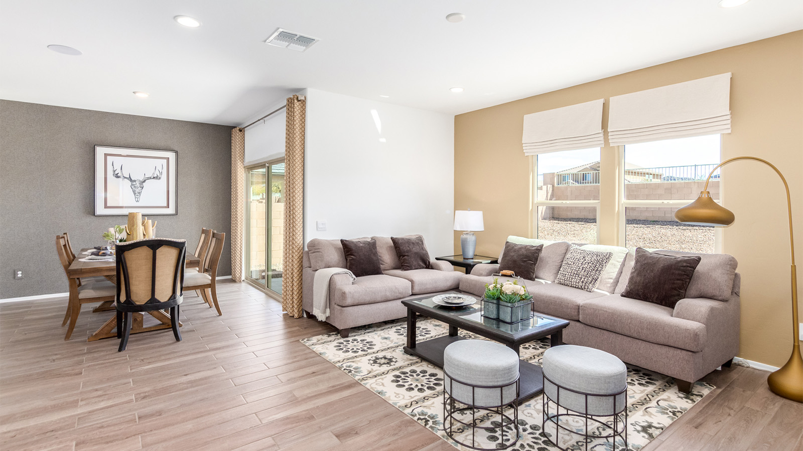 Step into The Cali at Barnett Village, Marana, Arizona – a perfect blend of comfort, modern living, and energy efficiency. This thoughtfully crafted one-story home spans 1,825 square feet and offers ample space featuring 4 bedrooms and 2 bathrooms, ideal for families of all sizes.  As you step through the front porch and into the welcoming entryway, you're immediately led into a thoughtfully designed space that maximizes every square foot. Near the entrance of the home you’ll find 2 bedrooms, ideal for guests or a home office, offering privacy and easy access to the main living areas.  Continuing through the home, you’ll enter the heart of The Cali – an expansive great room that seamlessly connects to the dining area and kitchen. This open-concept space is perfect for entertaining or everyday family living, allowing for a fluid transition from cooking to dining to relaxation. The kitchen is equipped with sleek quartz countertops, modern appliances, a pantry, and an island that doubles as a breakfast bar, providing ample space for meal prep and casual dining.  The primary bedroom, located at the rear of the home, provides a peaceful retreat with a private ensuite bathroom and a generous walk-in closet. The additional four bedrooms are positioned at the front of the house, offering versatility for use as guest rooms, a home office, or children’s bedrooms.  The Cali floor plan offers the option of an extended covered back patio. Whether it’s morning coffee or evening relaxation, this outdoor space extends your living area into the serene landscape of Barnett Village.  Designed with energy efficiency in mind, The Cali at Barnett Village is DOE Zero Energy Ready Home certified, ensuring long-term savings and a comfortable living environment.