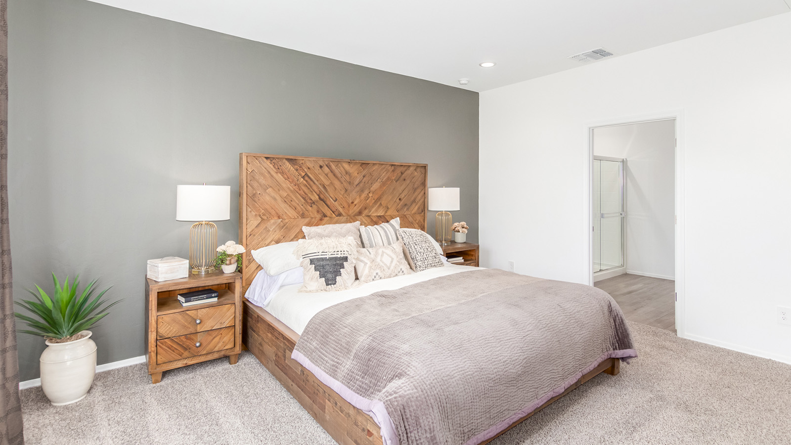 Step into The Cali at Barnett Village, Marana, Arizona – a perfect blend of comfort, modern living, and energy efficiency. This thoughtfully crafted one-story home spans 1,825 square feet and offers ample space featuring 4 bedrooms and 2 bathrooms, ideal for families of all sizes.  As you step through the front porch and into the welcoming entryway, you're immediately led into a thoughtfully designed space that maximizes every square foot. Near the entrance of the home you’ll find 2 bedrooms, ideal for guests or a home office, offering privacy and easy access to the main living areas.  Continuing through the home, you’ll enter the heart of The Cali – an expansive great room that seamlessly connects to the dining area and kitchen. This open-concept space is perfect for entertaining or everyday family living, allowing for a fluid transition from cooking to dining to relaxation. The kitchen is equipped with sleek quartz countertops, modern appliances, a pantry, and an island that doubles as a breakfast bar, providing ample space for meal prep and casual dining.  The primary bedroom, located at the rear of the home, provides a peaceful retreat with a private ensuite bathroom and a generous walk-in closet. The additional four bedrooms are positioned at the front of the house, offering versatility for use as guest rooms, a home office, or children’s bedrooms.  The Cali floor plan offers the option of an extended covered back patio. Whether it’s morning coffee or evening relaxation, this outdoor space extends your living area into the serene landscape of Barnett Village.  Designed with energy efficiency in mind, The Cali at Barnett Village is DOE Zero Energy Ready Home certified, ensuring long-term savings and a comfortable living environment.