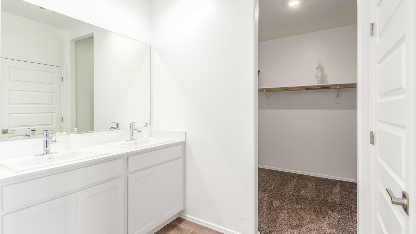 Step into The Cali at Barnett Village, Marana, Arizona – a perfect blend of comfort, modern living, and energy efficiency. This thoughtfully crafted one-story home spans 1,825 square feet and offers ample space featuring 4 bedrooms and 2 bathrooms, ideal for families of all sizes.  As you step through the front porch and into the welcoming entryway, you're immediately led into a thoughtfully designed space that maximizes every square foot. Near the entrance of the home you’ll find 2 bedrooms, ideal for guests or a home office, offering privacy and easy access to the main living areas.  Continuing through the home, you’ll enter the heart of The Cali – an expansive great room that seamlessly connects to the dining area and kitchen. This open-concept space is perfect for entertaining or everyday family living, allowing for a fluid transition from cooking to dining to relaxation. The kitchen is equipped with sleek quartz countertops, modern appliances, a pantry, and an island that doubles as a breakfast bar, providing ample space for meal prep and casual dining.  The primary bedroom, located at the rear of the home, provides a peaceful retreat with a private ensuite bathroom and a generous walk-in closet. The additional four bedrooms are positioned at the front of the house, offering versatility for use as guest rooms, a home office, or children’s bedrooms.  The Cali floor plan offers the option of an extended covered back patio. Whether it’s morning coffee or evening relaxation, this outdoor space extends your living area into the serene landscape of Barnett Village.  Designed with energy efficiency in mind, The Cali at Barnett Village is DOE Zero Energy Ready Home certified, ensuring long-term savings and a comfortable living environment.