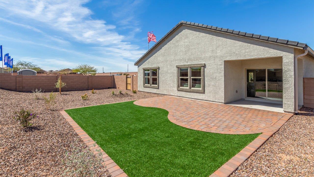 Step into The Cali at Barnett Village, Marana, Arizona – a perfect blend of comfort, modern living, and energy efficiency. This thoughtfully crafted one-story home spans 1,825 square feet and offers ample space featuring 4 bedrooms and 2 bathrooms, ideal for families of all sizes.  As you step through the front porch and into the welcoming entryway, you're immediately led into a thoughtfully designed space that maximizes every square foot. Near the entrance of the home you’ll find 2 bedrooms, ideal for guests or a home office, offering privacy and easy access to the main living areas.  Continuing through the home, you’ll enter the heart of The Cali – an expansive great room that seamlessly connects to the dining area and kitchen. This open-concept space is perfect for entertaining or everyday family living, allowing for a fluid transition from cooking to dining to relaxation. The kitchen is equipped with sleek quartz countertops, modern appliances, a pantry, and an island that doubles as a breakfast bar, providing ample space for meal prep and casual dining.  The primary bedroom, located at the rear of the home, provides a peaceful retreat with a private ensuite bathroom and a generous walk-in closet. The additional four bedrooms are positioned at the front of the house, offering versatility for use as guest rooms, a home office, or children’s bedrooms.  The Cali floor plan offers the option of an extended covered back patio. Whether it’s morning coffee or evening relaxation, this outdoor space extends your living area into the serene landscape of Barnett Village.  Designed with energy efficiency in mind, The Cali at Barnett Village is DOE Zero Energy Ready Home certified, ensuring long-term savings and a comfortable living environment.