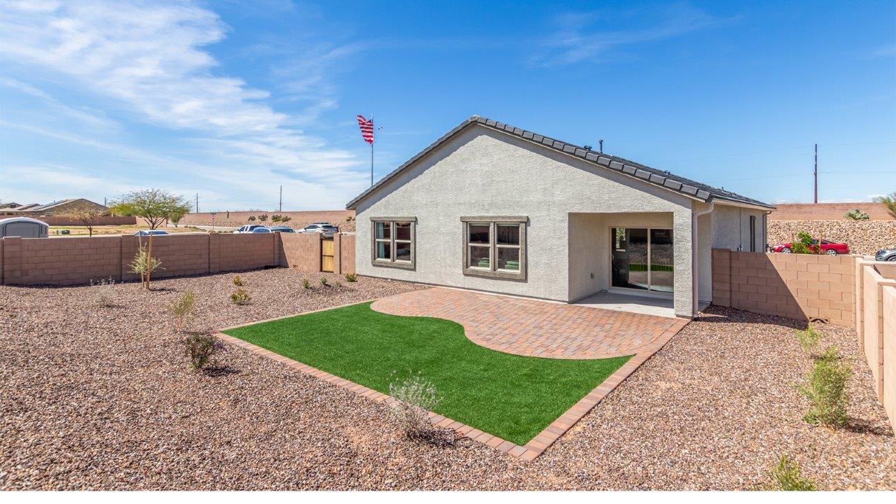 Step into The Cali at Barnett Village, Marana, Arizona – a perfect blend of comfort, modern living, and energy efficiency. This thoughtfully crafted one-story home spans 1,825 square feet and offers ample space featuring 4 bedrooms and 2 bathrooms, ideal for families of all sizes.  As you step through the front porch and into the welcoming entryway, you're immediately led into a thoughtfully designed space that maximizes every square foot. Near the entrance of the home you’ll find 2 bedrooms, ideal for guests or a home office, offering privacy and easy access to the main living areas.  Continuing through the home, you’ll enter the heart of The Cali – an expansive great room that seamlessly connects to the dining area and kitchen. This open-concept space is perfect for entertaining or everyday family living, allowing for a fluid transition from cooking to dining to relaxation. The kitchen is equipped with sleek quartz countertops, modern appliances, a pantry, and an island that doubles as a breakfast bar, providing ample space for meal prep and casual dining.  The primary bedroom, located at the rear of the home, provides a peaceful retreat with a private ensuite bathroom and a generous walk-in closet. The additional four bedrooms are positioned at the front of the house, offering versatility for use as guest rooms, a home office, or children’s bedrooms.  The Cali floor plan offers the option of an extended covered back patio. Whether it’s morning coffee or evening relaxation, this outdoor space extends your living area into the serene landscape of Barnett Village.  Designed with energy efficiency in mind, The Cali at Barnett Village is DOE Zero Energy Ready Home certified, ensuring long-term savings and a comfortable living environment.