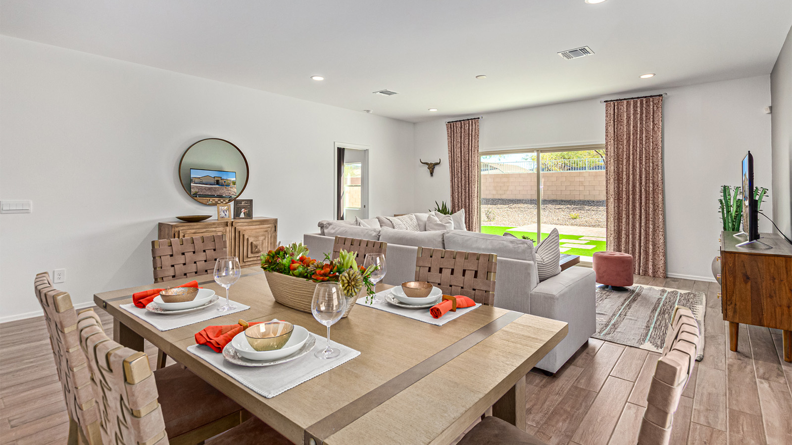 Step into The Kingston at Barnett Village, Marana, Arizona – a perfect blend of comfort, modern living, and energy efficiency. This thoughtfully crafted one-story home spans 2,068 square feet and offers four bedrooms and two bathrooms, ideal for families of all sizes.  The open-concept design features a spacious great room that effortlessly connects with the kitchen and dining area, creating an inviting central hub for everyday living and entertaining. The kitchen is equipped with contemporary appliances and a pantry, offering ample storage and convenience for meal preparation.  The primary bedroom, located at the rear of the home, provides a peaceful retreat with a private ensuite bathroom and a generous walk-in closet. The additional three bedrooms are positioned at the front of the house, offering versatility for use as guest rooms, a home office, or children’s bedrooms. Step outside to the covered patio, a perfect spot to enjoy the beautiful Arizona weather, whether for morning coffee or evening relaxation.  The Kingston also boasts a covered patio, perfect for enjoying Arizona’s beautiful desert evenings. Whether it’s morning coffee or evening relaxation, this outdoor space extends your living area into the serene landscape of Barnett Village.  Built with energy efficiency as a priority, the Kingston includes smart home technology, which not only simplifies daily living but also helps reduce utility costs. A two-car garage provides ample parking and additional storage space, enhancing the home’s functionality.  *Images shown are for reference only. They depict The Kingston sales model home and may not represent the actual home.