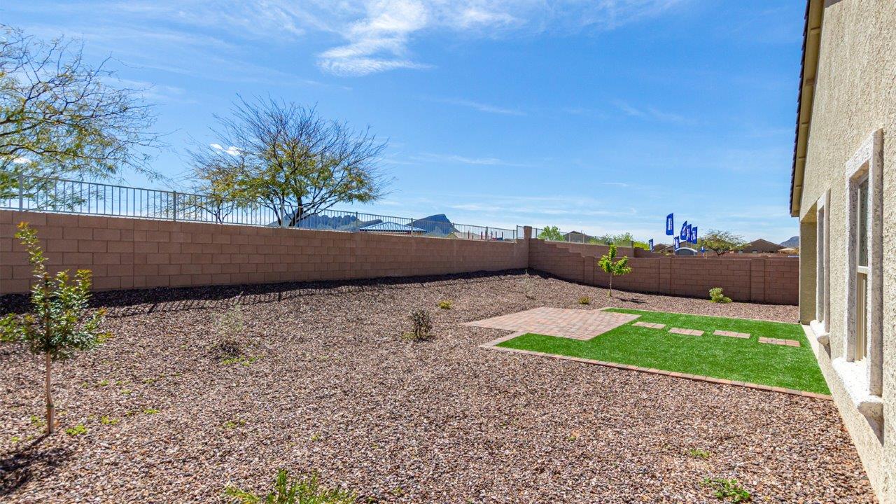 Step into The Kingston at Barnett Village, Marana, Arizona – a perfect blend of comfort, modern living, and energy efficiency. This thoughtfully crafted one-story home spans 2,068 square feet and offers four bedrooms and two bathrooms, ideal for families of all sizes.  The open-concept design features a spacious great room that effortlessly connects with the kitchen and dining area, creating an inviting central hub for everyday living and entertaining. The kitchen is equipped with contemporary appliances and a pantry, offering ample storage and convenience for meal preparation.  The primary bedroom, located at the rear of the home, provides a peaceful retreat with a private ensuite bathroom and a generous walk-in closet. The additional three bedrooms are positioned at the front of the house, offering versatility for use as guest rooms, a home office, or children’s bedrooms. Step outside to the covered patio, a perfect spot to enjoy the beautiful Arizona weather, whether for morning coffee or evening relaxation.  The Kingston also boasts a covered patio, perfect for enjoying Arizona’s beautiful desert evenings. Whether it’s morning coffee or evening relaxation, this outdoor space extends your living area into the serene landscape of Barnett Village.  Built with energy efficiency as a priority, the Kingston includes smart home technology, which not only simplifies daily living but also helps reduce utility costs. A two-car garage provides ample parking and additional storage space, enhancing the home’s functionality.  *Images shown are for reference only. They depict The Kingston sales model home and may not represent the actual home.