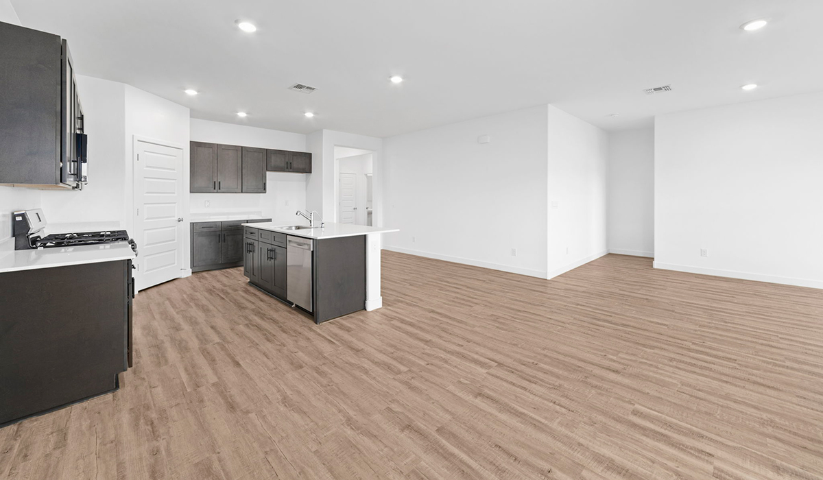 Introducing the York — a thoughtfully designed new floor plan at Solterra by D.R. Horton in Green Valley. Offering 1,863 square feet of well-planned living space, the York is ideal for those seeking a home that balances comfort, flexibility, and modern design.  Step inside through the welcoming entryway and experience an open-concept layout that maximizes every square foot. The expansive great room serves as the heart of the home, flowing seamlessly into the dining area and kitchen, perfect for both everyday living and entertaining. The kitchen features a spacious center island, quartz countertops, Shaker-style cabinetry, and a dedicated pantry, delivering a clean, modern aesthetic with ample storage for all your culinary essentials.  The York is available in two- and three-bedroom configurations, offering flexibility to meet a variety of lifestyle needs. The primary suite is thoughtfully located at the rear of the home for added privacy and includes a linen closet, walk-in closet, and a well-appointed ensuite bathroom. Near the front of the home is a powder room, guest bedroom with walk-in closet and ensuite bathroom, and study that creates a functional layout for guests, work-from-home needs, or additional living space.  Designed with both comfort and practicality in mind, the York includes a utility room conveniently located near the kitchen and garage, providing easy access to the laundry area and additional storage. A covered back patio extends the living space outdoors—ideal for relaxing and enjoying Green Valley’s beautiful year-round weather.  Homes at Solterra feature elegant, modern interiors paired with distinctive exterior details, including sand finish texture stucco, landscaped front yards with auto drip irrigation, and fully fenced backyards. Covered back patios offer inviting spaces to unwind and take in Green Valley’s breathtaking sunsets. Inside, D.R. Horton’s Home is Connected® Smart Home package enhances everyday living with a smart thermostat, video doorbell, keyless entry, and a Wi-Fi–enabled garage door opener.  Outdoor enthusiasts will appreciate the close proximity to scenic neighborhood parks, Colossal Cave Mountain Park, and an extensive network of walking and biking trails throughout Green Valley—making the York a perfect blend of comfort, style, and lifestyle-driven design.