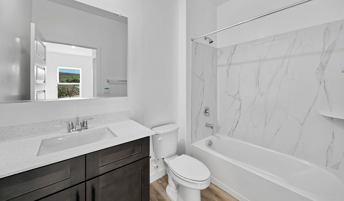 Introducing the York — a thoughtfully designed new floor plan at Solterra by D.R. Horton in Green Valley. Offering 1,863 square feet of well-planned living space, the York is ideal for those seeking a home that balances comfort, flexibility, and modern design.  Step inside through the welcoming entryway and experience an open-concept layout that maximizes every square foot. The expansive great room serves as the heart of the home, flowing seamlessly into the dining area and kitchen, perfect for both everyday living and entertaining. The kitchen features a spacious center island, quartz countertops, Shaker-style cabinetry, and a dedicated pantry, delivering a clean, modern aesthetic with ample storage for all your culinary essentials.  The York is available in two- and three-bedroom configurations, offering flexibility to meet a variety of lifestyle needs. The primary suite is thoughtfully located at the rear of the home for added privacy and includes a linen closet, walk-in closet, and a well-appointed ensuite bathroom. Near the front of the home is a powder room, guest bedroom with walk-in closet and ensuite bathroom, and study that creates a functional layout for guests, work-from-home needs, or additional living space.  Designed with both comfort and practicality in mind, the York includes a utility room conveniently located near the kitchen and garage, providing easy access to the laundry area and additional storage. A covered back patio extends the living space outdoors—ideal for relaxing and enjoying Green Valley’s beautiful year-round weather.  Homes at Solterra feature elegant, modern interiors paired with distinctive exterior details, including sand finish texture stucco, landscaped front yards with auto drip irrigation, and fully fenced backyards. Covered back patios offer inviting spaces to unwind and take in Green Valley’s breathtaking sunsets. Inside, D.R. Horton’s Home is Connected® Smart Home package enhances everyday living with a smart thermostat, video doorbell, keyless entry, and a Wi-Fi–enabled garage door opener.  Outdoor enthusiasts will appreciate the close proximity to scenic neighborhood parks, Colossal Cave Mountain Park, and an extensive network of walking and biking trails throughout Green Valley—making the York a perfect blend of comfort, style, and lifestyle-driven design.