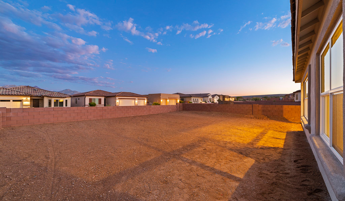 Introducing the York — a thoughtfully designed new floor plan at Solterra by D.R. Horton in Green Valley. Offering 1,863 square feet of well-planned living space, the York is ideal for those seeking a home that balances comfort, flexibility, and modern design.  Step inside through the welcoming entryway and experience an open-concept layout that maximizes every square foot. The expansive great room serves as the heart of the home, flowing seamlessly into the dining area and kitchen, perfect for both everyday living and entertaining. The kitchen features a spacious center island, quartz countertops, Shaker-style cabinetry, and a dedicated pantry, delivering a clean, modern aesthetic with ample storage for all your culinary essentials.  The York is available in two- and three-bedroom configurations, offering flexibility to meet a variety of lifestyle needs. The primary suite is thoughtfully located at the rear of the home for added privacy and includes a linen closet, walk-in closet, and a well-appointed ensuite bathroom. Near the front of the home is a powder room, guest bedroom with walk-in closet and ensuite bathroom, and study that creates a functional layout for guests, work-from-home needs, or additional living space.  Designed with both comfort and practicality in mind, the York includes a utility room conveniently located near the kitchen and garage, providing easy access to the laundry area and additional storage. A covered back patio extends the living space outdoors—ideal for relaxing and enjoying Green Valley’s beautiful year-round weather.  Homes at Solterra feature elegant, modern interiors paired with distinctive exterior details, including sand finish texture stucco, landscaped front yards with auto drip irrigation, and fully fenced backyards. Covered back patios offer inviting spaces to unwind and take in Green Valley’s breathtaking sunsets. Inside, D.R. Horton’s Home is Connected® Smart Home package enhances everyday living with a smart thermostat, video doorbell, keyless entry, and a Wi-Fi–enabled garage door opener.  Outdoor enthusiasts will appreciate the close proximity to scenic neighborhood parks, Colossal Cave Mountain Park, and an extensive network of walking and biking trails throughout Green Valley—making the York a perfect blend of comfort, style, and lifestyle-driven design.