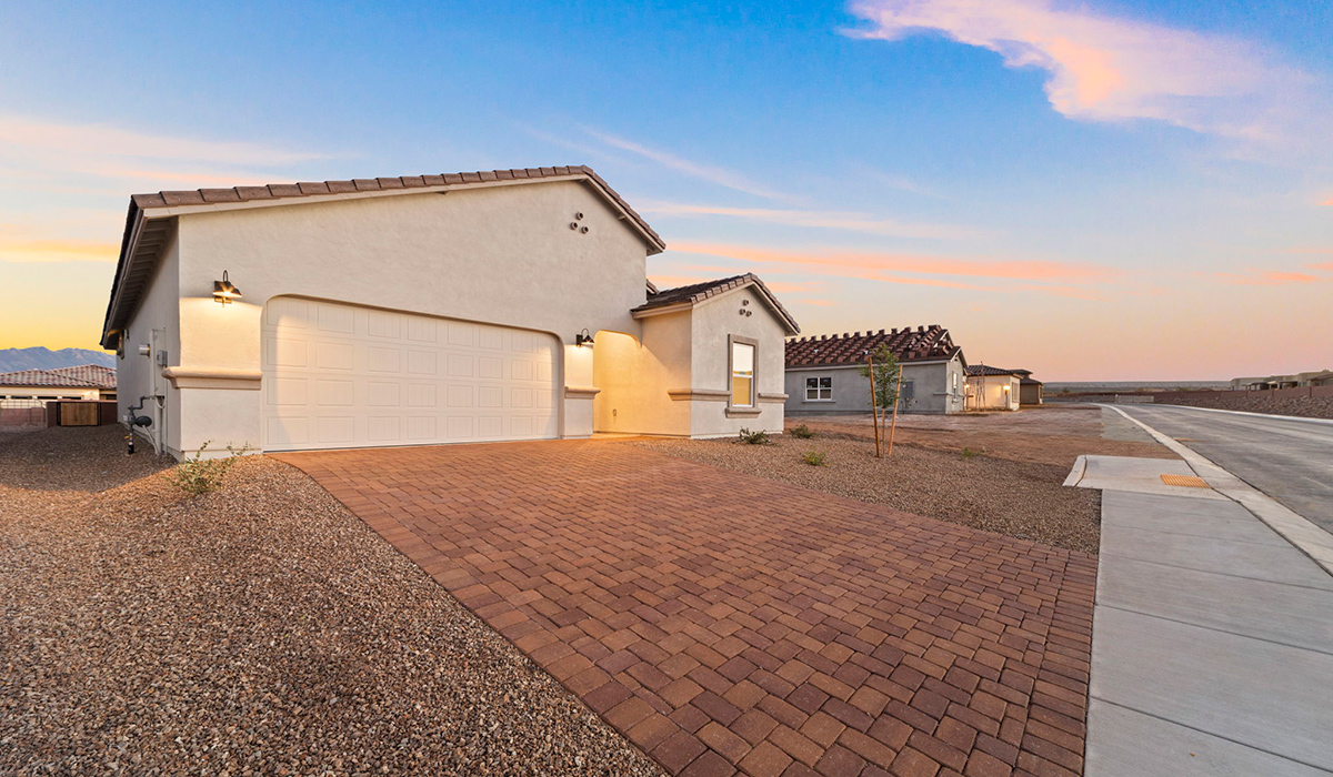 Introducing the York — a thoughtfully designed new floor plan at Solterra by D.R. Horton in Green Valley. Offering 1,863 square feet of well-planned living space, the York is ideal for those seeking a home that balances comfort, flexibility, and modern design.  Step inside through the welcoming entryway and experience an open-concept layout that maximizes every square foot. The expansive great room serves as the heart of the home, flowing seamlessly into the dining area and kitchen, perfect for both everyday living and entertaining. The kitchen features a spacious center island, quartz countertops, Shaker-style cabinetry, and a dedicated pantry, delivering a clean, modern aesthetic with ample storage for all your culinary essentials.  The York is available in two- and three-bedroom configurations, offering flexibility to meet a variety of lifestyle needs. The primary suite is thoughtfully located at the rear of the home for added privacy and includes a linen closet, walk-in closet, and a well-appointed ensuite bathroom. Near the front of the home is a powder room, guest bedroom with walk-in closet and ensuite bathroom, and study that creates a functional layout for guests, work-from-home needs, or additional living space.  Designed with both comfort and practicality in mind, the York includes a utility room conveniently located near the kitchen and garage, providing easy access to the laundry area and additional storage. A covered back patio extends the living space outdoors—ideal for relaxing and enjoying Green Valley’s beautiful year-round weather.  Homes at Solterra feature elegant, modern interiors paired with distinctive exterior details, including sand finish texture stucco, landscaped front yards with auto drip irrigation, and fully fenced backyards. Covered back patios offer inviting spaces to unwind and take in Green Valley’s breathtaking sunsets. Inside, D.R. Horton’s Home is Connected® Smart Home package enhances everyday living with a smart thermostat, video doorbell, keyless entry, and a Wi-Fi–enabled garage door opener.  Outdoor enthusiasts will appreciate the close proximity to scenic neighborhood parks, Colossal Cave Mountain Park, and an extensive network of walking and biking trails throughout Green Valley—making the York a perfect blend of comfort, style, and lifestyle-driven design.
