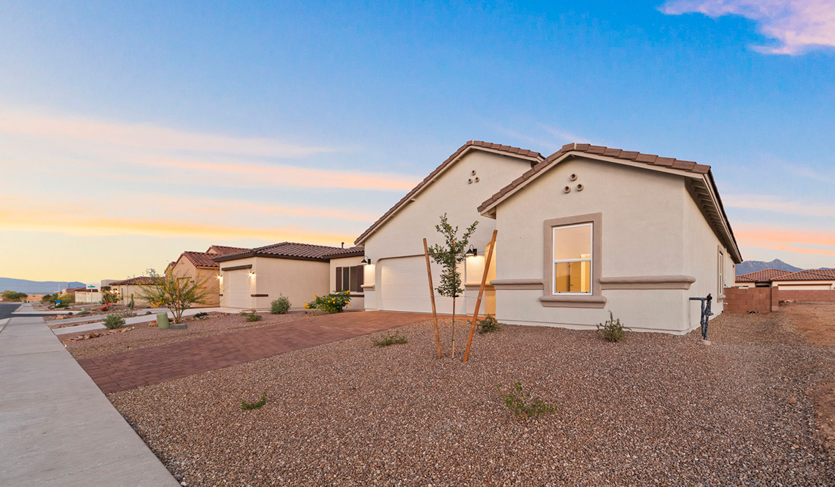 Introducing the York — a thoughtfully designed new floor plan at Solterra by D.R. Horton in Green Valley. Offering 1,863 square feet of well-planned living space, the York is ideal for those seeking a home that balances comfort, flexibility, and modern design.  Step inside through the welcoming entryway and experience an open-concept layout that maximizes every square foot. The expansive great room serves as the heart of the home, flowing seamlessly into the dining area and kitchen, perfect for both everyday living and entertaining. The kitchen features a spacious center island, quartz countertops, Shaker-style cabinetry, and a dedicated pantry, delivering a clean, modern aesthetic with ample storage for all your culinary essentials.  The York is available in two- and three-bedroom configurations, offering flexibility to meet a variety of lifestyle needs. The primary suite is thoughtfully located at the rear of the home for added privacy and includes a linen closet, walk-in closet, and a well-appointed ensuite bathroom. Near the front of the home is a powder room, guest bedroom with walk-in closet and ensuite bathroom, and study that creates a functional layout for guests, work-from-home needs, or additional living space.  Designed with both comfort and practicality in mind, the York includes a utility room conveniently located near the kitchen and garage, providing easy access to the laundry area and additional storage. A covered back patio extends the living space outdoors—ideal for relaxing and enjoying Green Valley’s beautiful year-round weather.  Homes at Solterra feature elegant, modern interiors paired with distinctive exterior details, including sand finish texture stucco, landscaped front yards with auto drip irrigation, and fully fenced backyards. Covered back patios offer inviting spaces to unwind and take in Green Valley’s breathtaking sunsets. Inside, D.R. Horton’s Home is Connected® Smart Home package enhances everyday living with a smart thermostat, video doorbell, keyless entry, and a Wi-Fi–enabled garage door opener.  Outdoor enthusiasts will appreciate the close proximity to scenic neighborhood parks, Colossal Cave Mountain Park, and an extensive network of walking and biking trails throughout Green Valley—making the York a perfect blend of comfort, style, and lifestyle-driven design.
