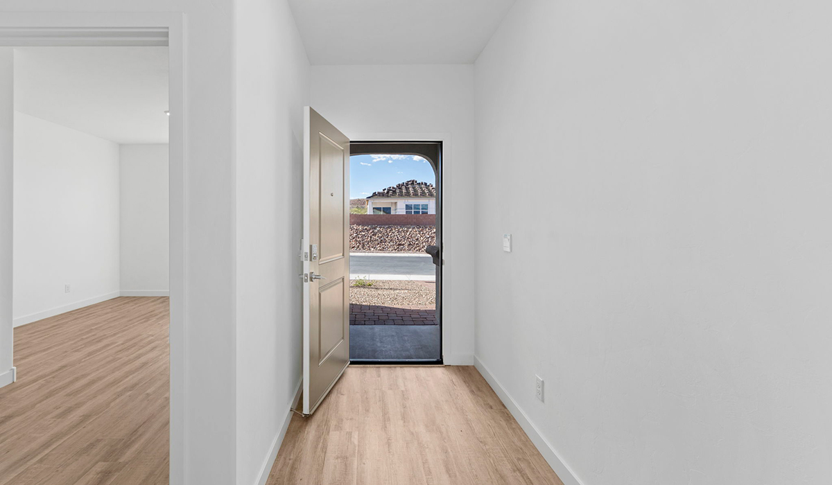 Introducing the York — a thoughtfully designed new floor plan at Solterra by D.R. Horton in Green Valley. Offering 1,863 square feet of well-planned living space, the York is ideal for those seeking a home that balances comfort, flexibility, and modern design.  Step inside through the welcoming entryway and experience an open-concept layout that maximizes every square foot. The expansive great room serves as the heart of the home, flowing seamlessly into the dining area and kitchen, perfect for both everyday living and entertaining. The kitchen features a spacious center island, quartz countertops, Shaker-style cabinetry, and a dedicated pantry, delivering a clean, modern aesthetic with ample storage for all your culinary essentials.  The York is available in two- and three-bedroom configurations, offering flexibility to meet a variety of lifestyle needs. The primary suite is thoughtfully located at the rear of the home for added privacy and includes a linen closet, walk-in closet, and a well-appointed ensuite bathroom. Near the front of the home is a powder room, guest bedroom with walk-in closet and ensuite bathroom, and study that creates a functional layout for guests, work-from-home needs, or additional living space.  Designed with both comfort and practicality in mind, the York includes a utility room conveniently located near the kitchen and garage, providing easy access to the laundry area and additional storage. A covered back patio extends the living space outdoors—ideal for relaxing and enjoying Green Valley’s beautiful year-round weather.  Homes at Solterra feature elegant, modern interiors paired with distinctive exterior details, including sand finish texture stucco, landscaped front yards with auto drip irrigation, and fully fenced backyards. Covered back patios offer inviting spaces to unwind and take in Green Valley’s breathtaking sunsets. Inside, D.R. Horton’s Home is Connected® Smart Home package enhances everyday living with a smart thermostat, video doorbell, keyless entry, and a Wi-Fi–enabled garage door opener.  Outdoor enthusiasts will appreciate the close proximity to scenic neighborhood parks, Colossal Cave Mountain Park, and an extensive network of walking and biking trails throughout Green Valley—making the York a perfect blend of comfort, style, and lifestyle-driven design.