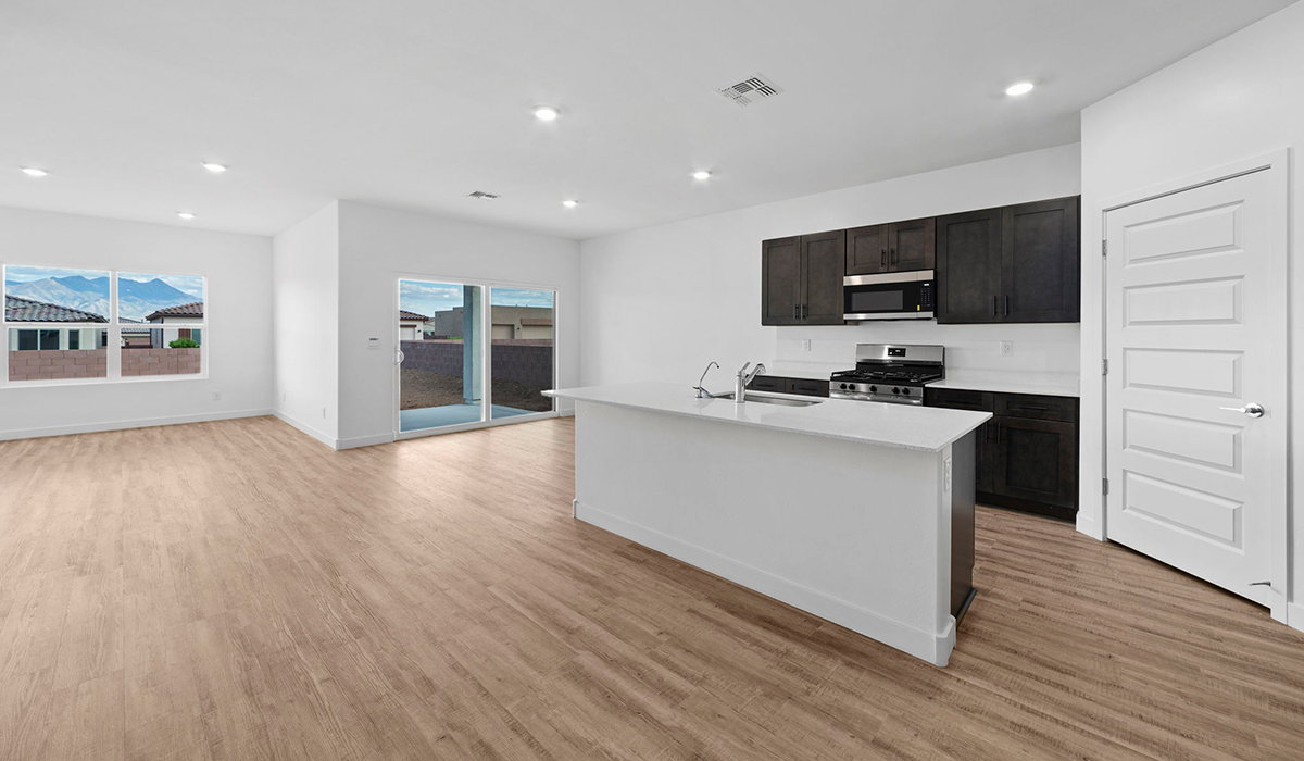 Introducing the York — a thoughtfully designed new floor plan at Solterra by D.R. Horton in Green Valley. Offering 1,863 square feet of well-planned living space, the York is ideal for those seeking a home that balances comfort, flexibility, and modern design.  Step inside through the welcoming entryway and experience an open-concept layout that maximizes every square foot. The expansive great room serves as the heart of the home, flowing seamlessly into the dining area and kitchen, perfect for both everyday living and entertaining. The kitchen features a spacious center island, quartz countertops, Shaker-style cabinetry, and a dedicated pantry, delivering a clean, modern aesthetic with ample storage for all your culinary essentials.  The York is available in two- and three-bedroom configurations, offering flexibility to meet a variety of lifestyle needs. The primary suite is thoughtfully located at the rear of the home for added privacy and includes a linen closet, walk-in closet, and a well-appointed ensuite bathroom. Near the front of the home is a powder room, guest bedroom with walk-in closet and ensuite bathroom, and study that creates a functional layout for guests, work-from-home needs, or additional living space.  Designed with both comfort and practicality in mind, the York includes a utility room conveniently located near the kitchen and garage, providing easy access to the laundry area and additional storage. A covered back patio extends the living space outdoors—ideal for relaxing and enjoying Green Valley’s beautiful year-round weather.  Homes at Solterra feature elegant, modern interiors paired with distinctive exterior details, including sand finish texture stucco, landscaped front yards with auto drip irrigation, and fully fenced backyards. Covered back patios offer inviting spaces to unwind and take in Green Valley’s breathtaking sunsets. Inside, D.R. Horton’s Home is Connected® Smart Home package enhances everyday living with a smart thermostat, video doorbell, keyless entry, and a Wi-Fi–enabled garage door opener.  Outdoor enthusiasts will appreciate the close proximity to scenic neighborhood parks, Colossal Cave Mountain Park, and an extensive network of walking and biking trails throughout Green Valley—making the York a perfect blend of comfort, style, and lifestyle-driven design.