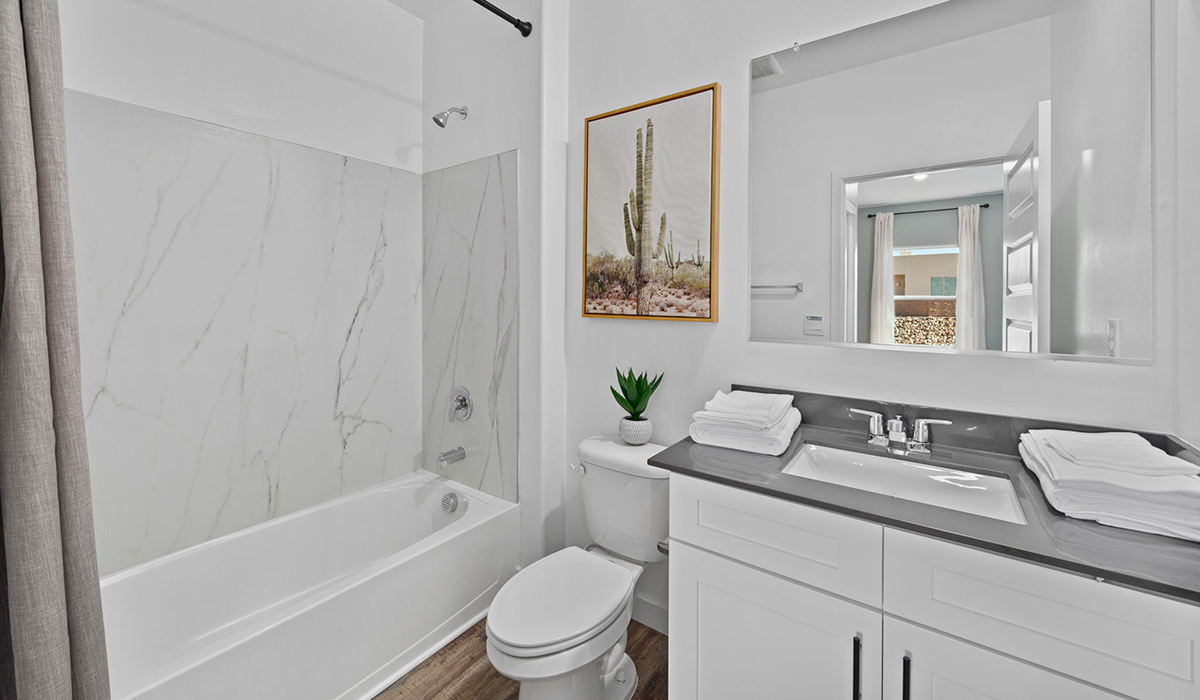 Introducing the York — a thoughtfully designed new floor plan at Solterra by D.R. Horton in Green Valley. Offering 1,863 square feet of well-planned living space, the York is ideal for those seeking a home that balances comfort, flexibility, and modern design.  Step inside through the welcoming entryway and experience an open-concept layout that maximizes every square foot. The expansive great room serves as the heart of the home, flowing seamlessly into the dining area and kitchen, perfect for both everyday living and entertaining. The kitchen features a spacious center island, quartz countertops, Shaker-style cabinetry, and a dedicated pantry, delivering a clean, modern aesthetic with ample storage for all your culinary essentials.  The York is available in two- and three-bedroom configurations, offering flexibility to meet a variety of lifestyle needs. The primary suite is thoughtfully located at the rear of the home for added privacy and includes a linen closet, walk-in closet, and a well-appointed ensuite bathroom. Near the front of the home is a powder room, guest bedroom with walk-in closet and ensuite bathroom, and study that creates a functional layout for guests, work-from-home needs, or additional living space.  Designed with both comfort and practicality in mind, the York includes a utility room conveniently located near the kitchen and garage, providing easy access to the laundry area and additional storage. A covered back patio extends the living space outdoors—ideal for relaxing and enjoying Green Valley’s beautiful year-round weather.  Homes at Solterra feature elegant, modern interiors paired with distinctive exterior details, including sand finish texture stucco, landscaped front yards with auto drip irrigation, and fully fenced backyards. Covered back patios offer inviting spaces to unwind and take in Green Valley’s breathtaking sunsets. Inside, D.R. Horton’s Home is Connected® Smart Home package enhances everyday living with a smart thermostat, video doorbell, keyless entry, and a Wi-Fi–enabled garage door opener.  Outdoor enthusiasts will appreciate the close proximity to scenic neighborhood parks, Colossal Cave Mountain Park, and an extensive network of walking and biking trails throughout Green Valley—making the York a perfect blend of comfort, style, and lifestyle-driven design.  *Images shown are for reference only. They depict the York model home and may not represent the actual home.