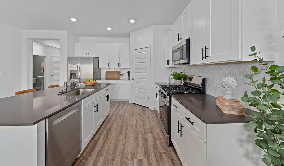 Introducing the York — a thoughtfully designed new floor plan at Solterra by D.R. Horton in Green Valley. Offering 1,863 square feet of well-planned living space, the York is ideal for those seeking a home that balances comfort, flexibility, and modern design.  Step inside through the welcoming entryway and experience an open-concept layout that maximizes every square foot. The expansive great room serves as the heart of the home, flowing seamlessly into the dining area and kitchen, perfect for both everyday living and entertaining. The kitchen features a spacious center island, quartz countertops, Shaker-style cabinetry, and a dedicated pantry, delivering a clean, modern aesthetic with ample storage for all your culinary essentials.  The York is available in two- and three-bedroom configurations, offering flexibility to meet a variety of lifestyle needs. The primary suite is thoughtfully located at the rear of the home for added privacy and includes a linen closet, walk-in closet, and a well-appointed ensuite bathroom. Near the front of the home is a powder room, guest bedroom with walk-in closet and ensuite bathroom, and study that creates a functional layout for guests, work-from-home needs, or additional living space.  Designed with both comfort and practicality in mind, the York includes a utility room conveniently located near the kitchen and garage, providing easy access to the laundry area and additional storage. A covered back patio extends the living space outdoors—ideal for relaxing and enjoying Green Valley’s beautiful year-round weather.  Homes at Solterra feature elegant, modern interiors paired with distinctive exterior details, including sand finish texture stucco, landscaped front yards with auto drip irrigation, and fully fenced backyards. Covered back patios offer inviting spaces to unwind and take in Green Valley’s breathtaking sunsets. Inside, D.R. Horton’s Home is Connected® Smart Home package enhances everyday living with a smart thermostat, video doorbell, keyless entry, and a Wi-Fi–enabled garage door opener.  Outdoor enthusiasts will appreciate the close proximity to scenic neighborhood parks, Colossal Cave Mountain Park, and an extensive network of walking and biking trails throughout Green Valley—making the York a perfect blend of comfort, style, and lifestyle-driven design.  *Images shown are for reference only. They depict the York model home and may not represent the actual home.