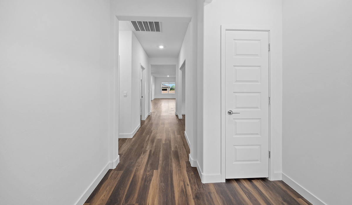 Introducing the Charleston — a beautifully designed new floor plan at Solterra by D.R. Horton in Green Valley. Offering 2,119 square feet of thoughtfully planned living space, the Charleston blends modern convenience with timeless elegance, creating a home that feels both refined and welcoming.  Step through the inviting entryway and into an open-concept layout designed to maximize every square foot. The expansive great room serves as the heart of the home, flowing seamlessly into the dining area and kitchen—ideal for both everyday living and entertaining. The kitchen features a spacious center island, quartz countertops, Shaker-style cabinetry, and a dedicated pantry, delivering a clean, modern aesthetic with ample storage for all your culinary needs.  The Charleston is available in two- and three-bedroom configurations, offering flexibility to meet a variety of lifestyle needs. The primary suite is thoughtfully located at the rear of the home for added privacy and includes a linen closet, walk-in closet, and a well-appointed ensuite bathroom. Near the front of the home is a powder room, guest bedroom with walk-in closet and ensuite bathroom, and study that creates a functional layout for guests, work-from-home needs, or additional living space.  Designed with practicality in mind, the Charleston includes a utility room conveniently located near the kitchen and garage, providing easy access to laundry and additional storage. A wrap around covered back patio extends the living space outdoors and is perfect for enjoying Green Valley’s beautiful year-round weather.  Homes at Solterra showcase elegant, modern interiors paired with distinctive exterior finishes, including sand finish texture stucco, landscaped front yards with auto drip irrigation, and fully fenced backyards. Covered back patios create inviting spaces to relax and take in Green Valley’s breathtaking sunsets. Inside, D.R. Horton’s Home is Connected® Smart Home package enhances everyday living with a smart thermostat, video doorbell, keyless entry, and a Wi-Fi–enabled garage door opener.  Outdoor enthusiasts will appreciate the close proximity to scenic neighborhood parks, Colossal Cave Mountain Park, and an abundance of walking and biking trails that weave throughout Green Valley, making the Charleston a perfect blend of comfort, style, and outdoor living.